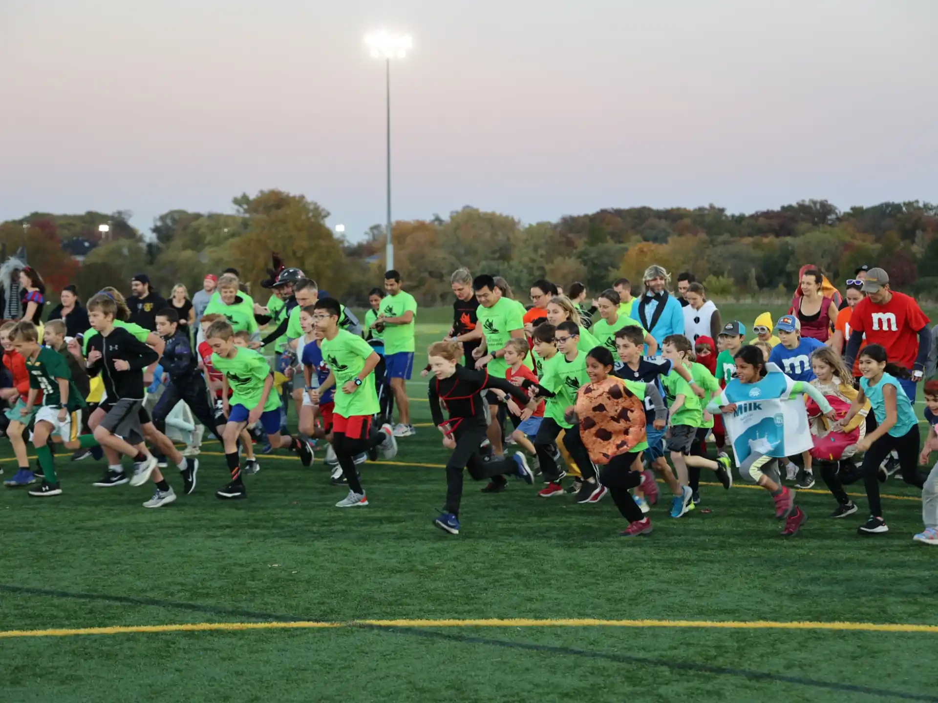 a group of people running on a field