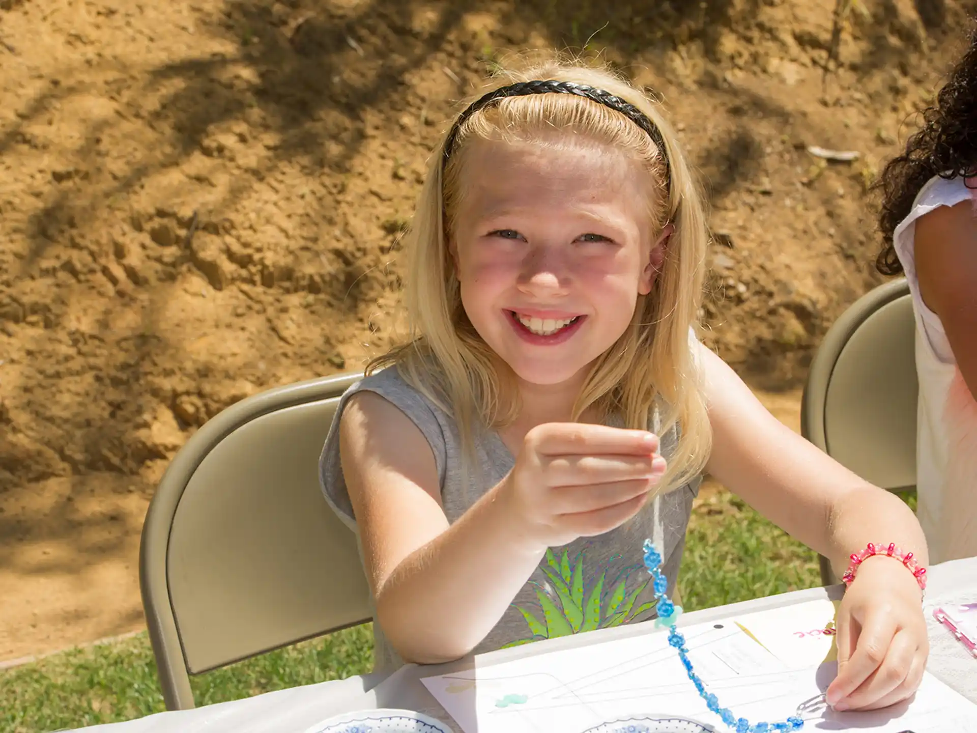 a girl sitting at a table