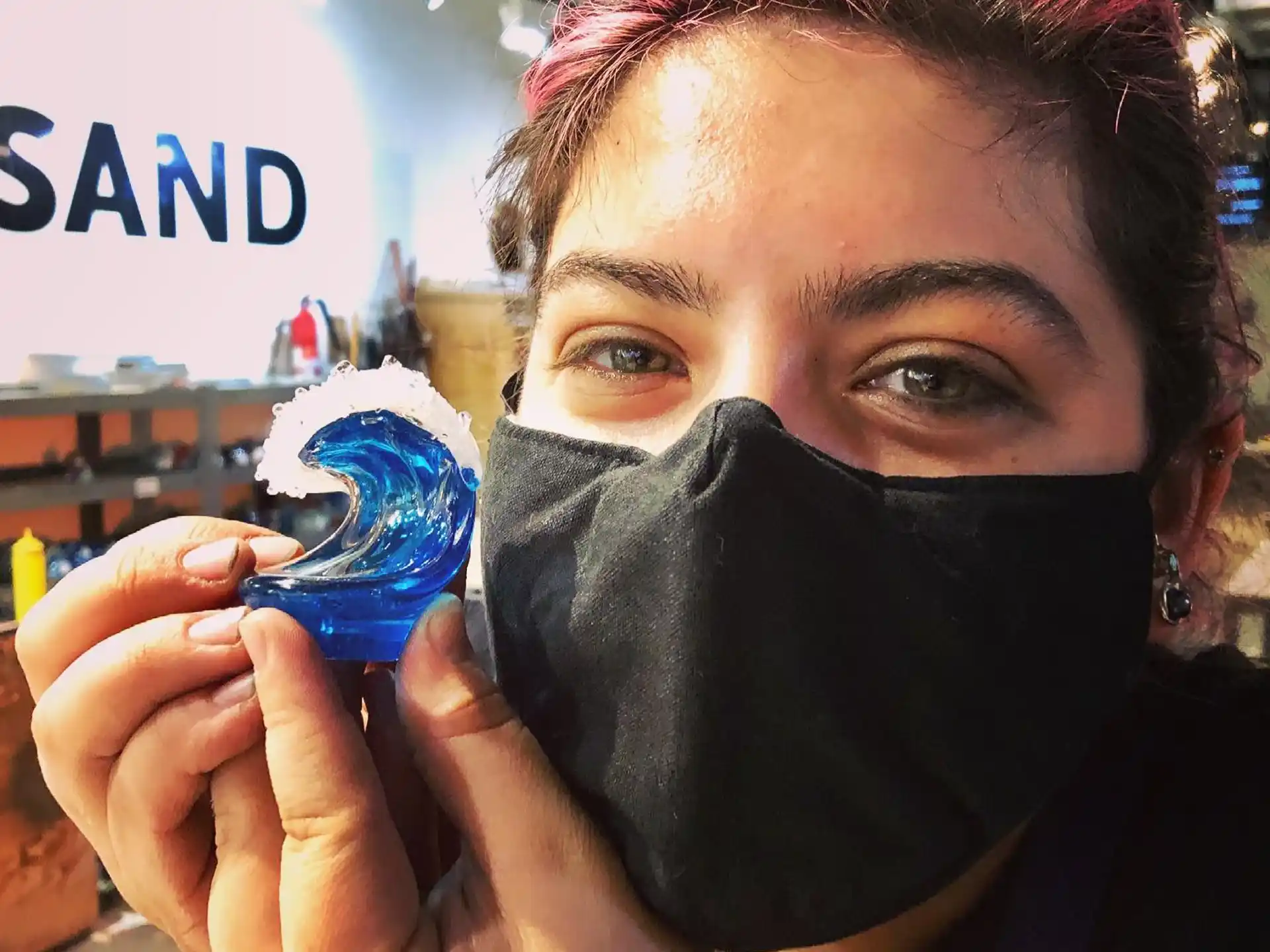 a person holding a blue and white can