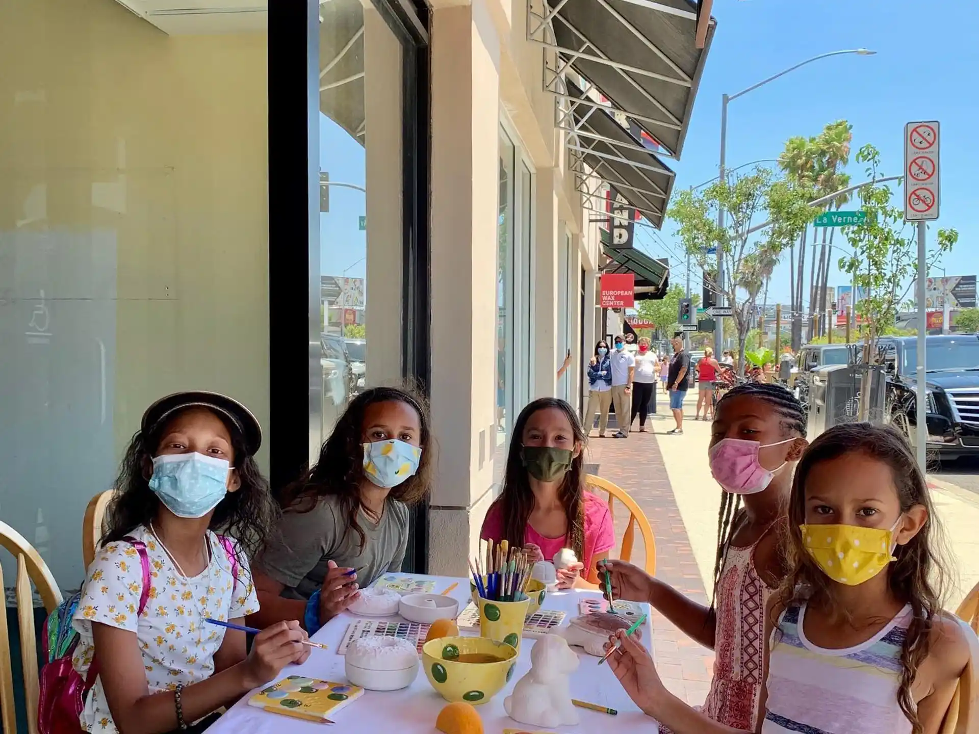 a group of women wearing face masks