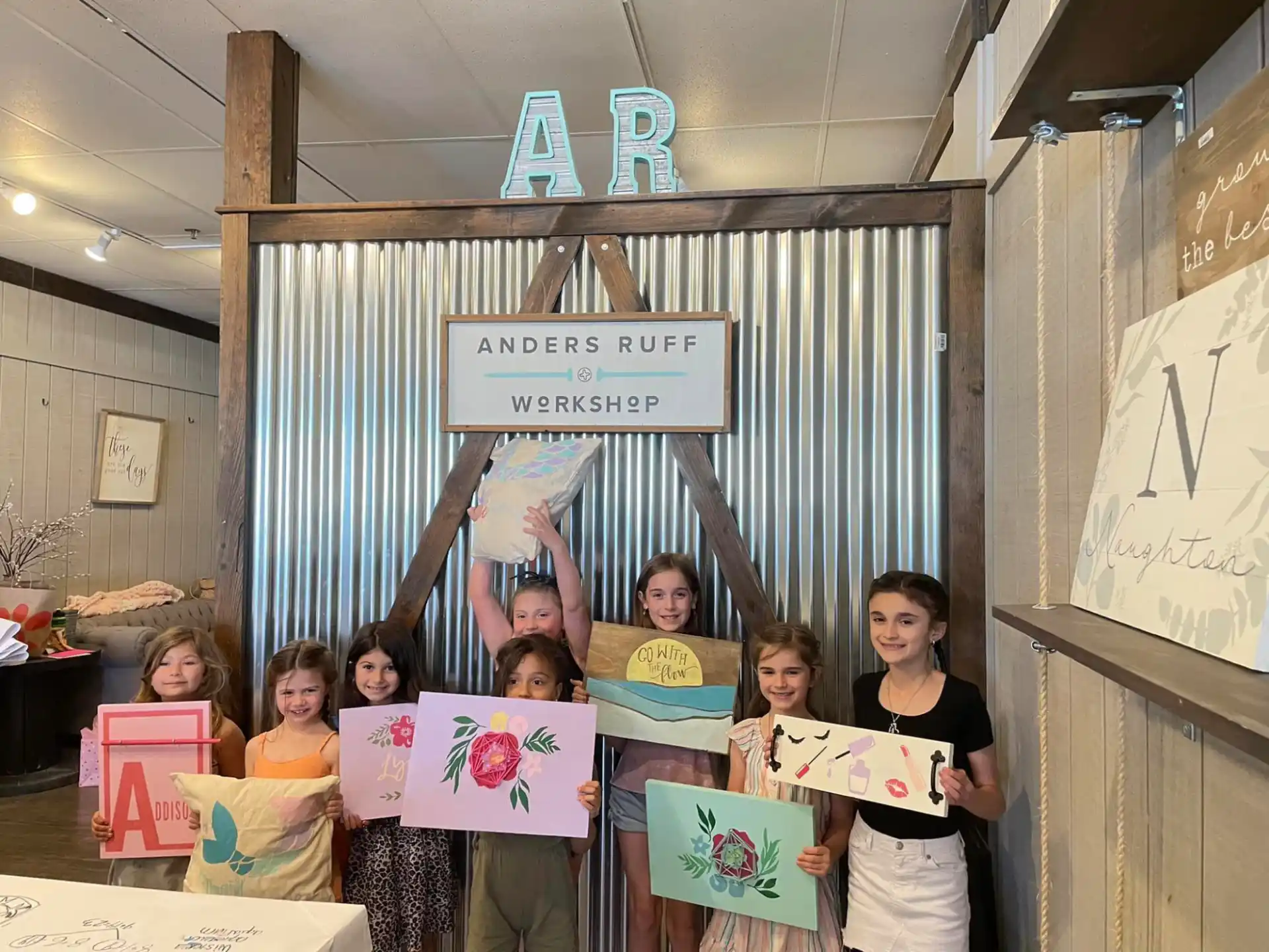 a group of children holding signs