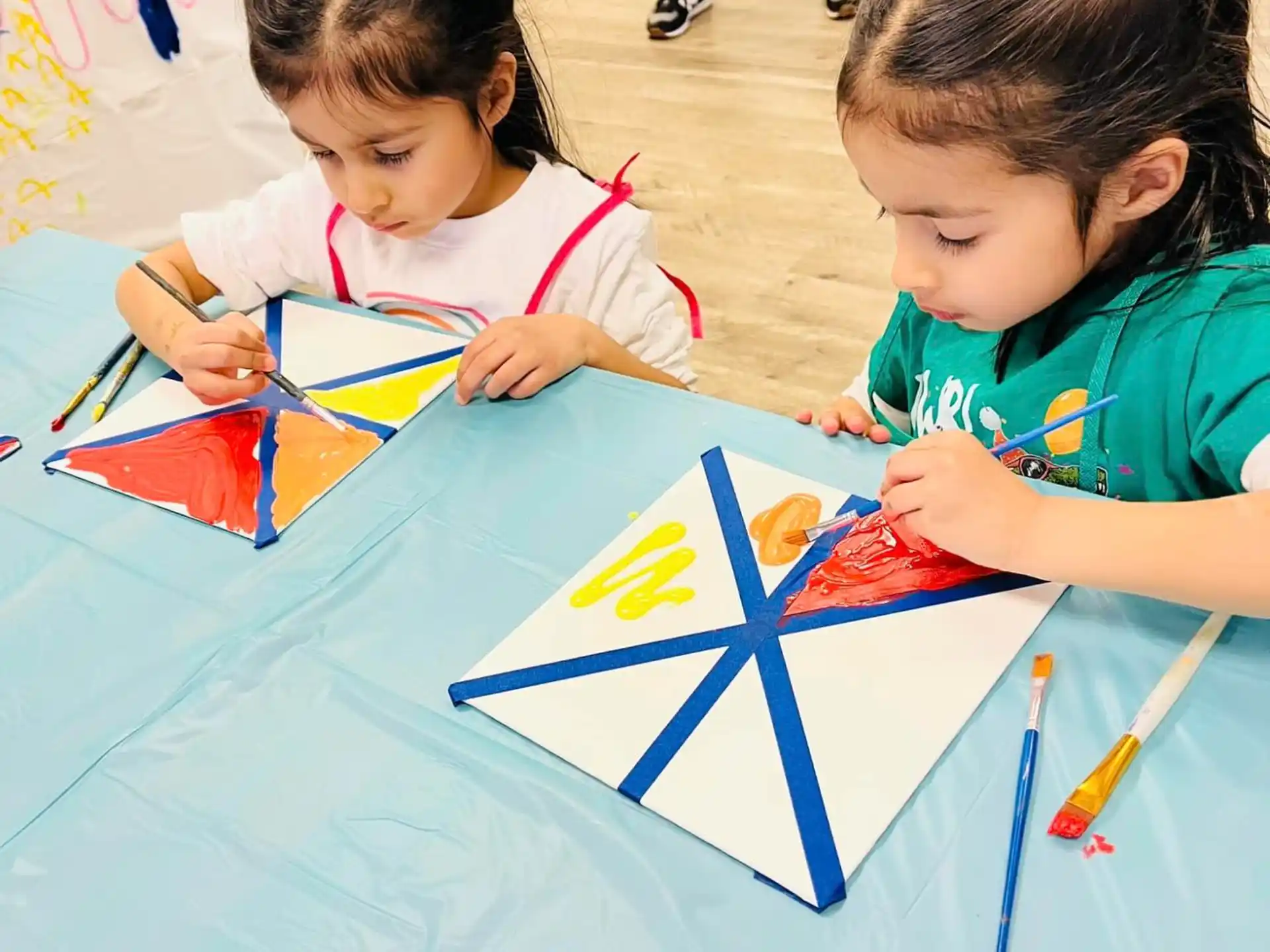 a couple of young girls painting