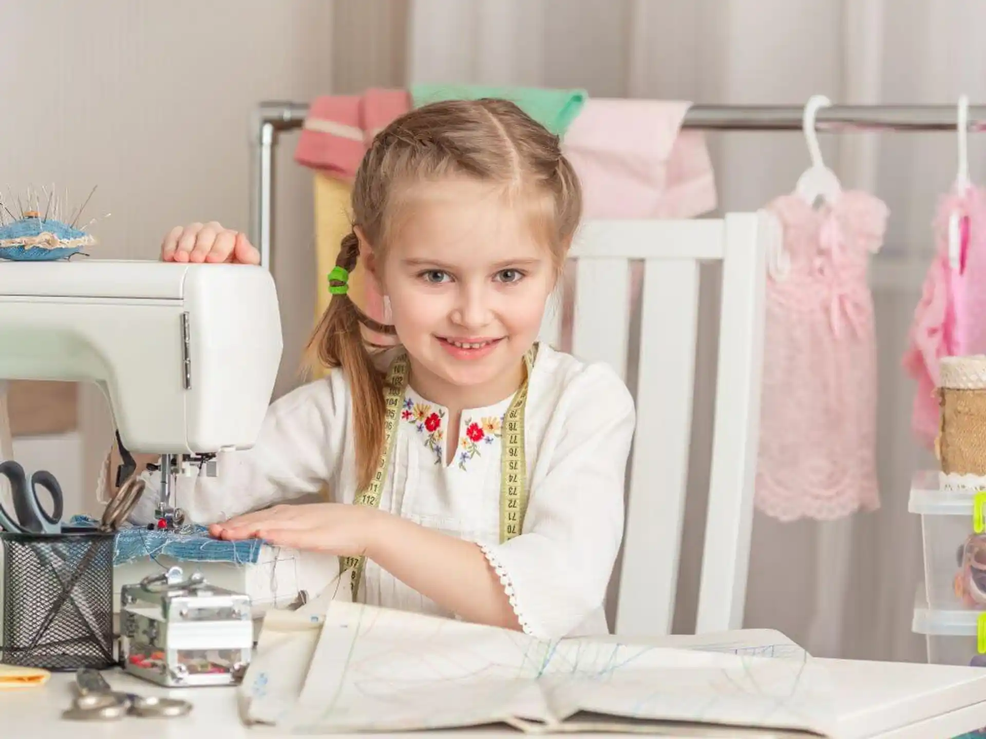 a young girl sitting at a table