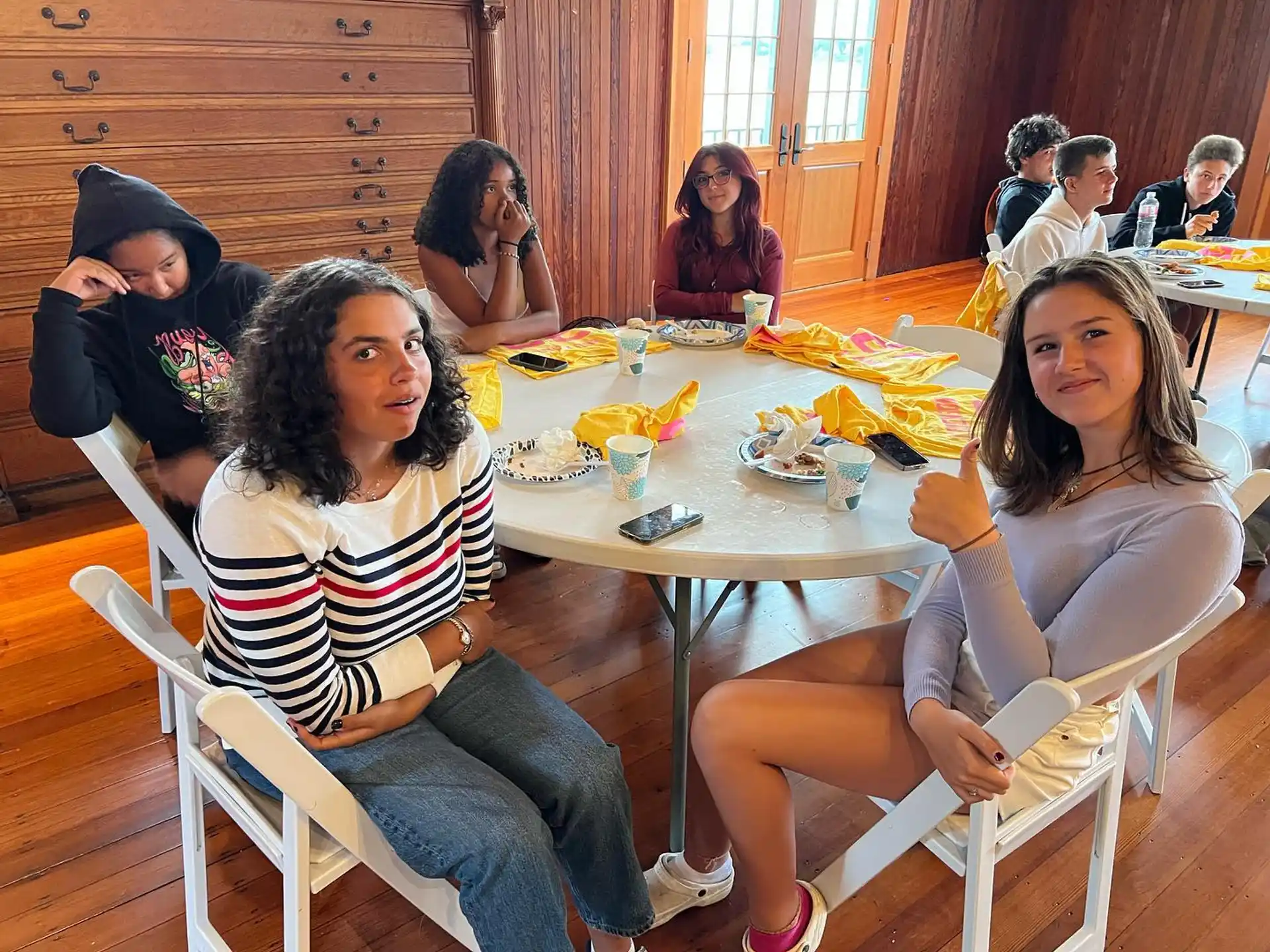 a group of people sitting around a table