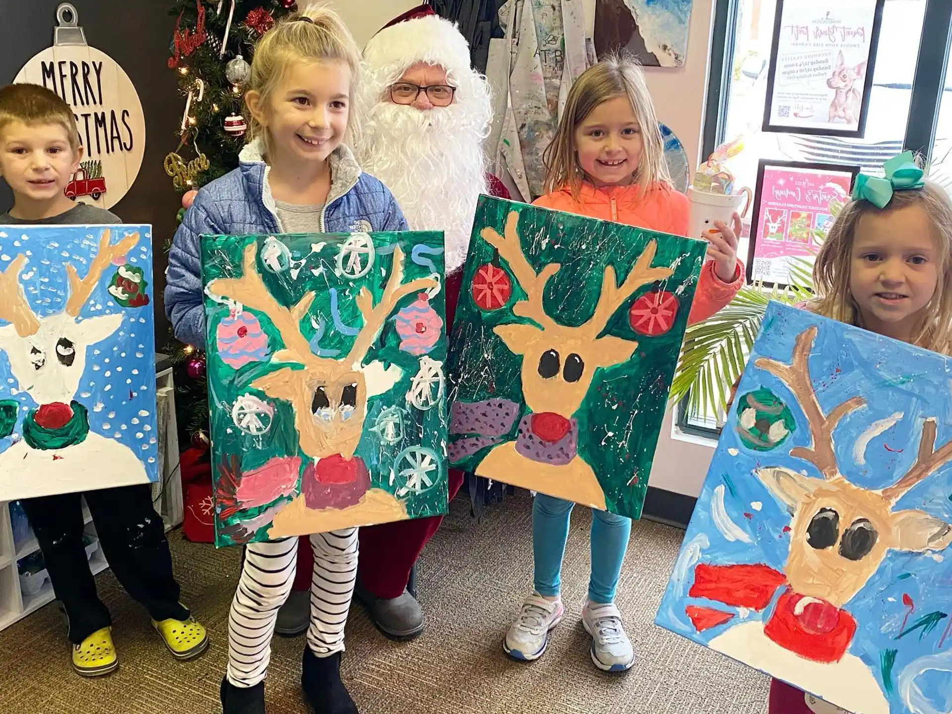 a group of children holding up posters