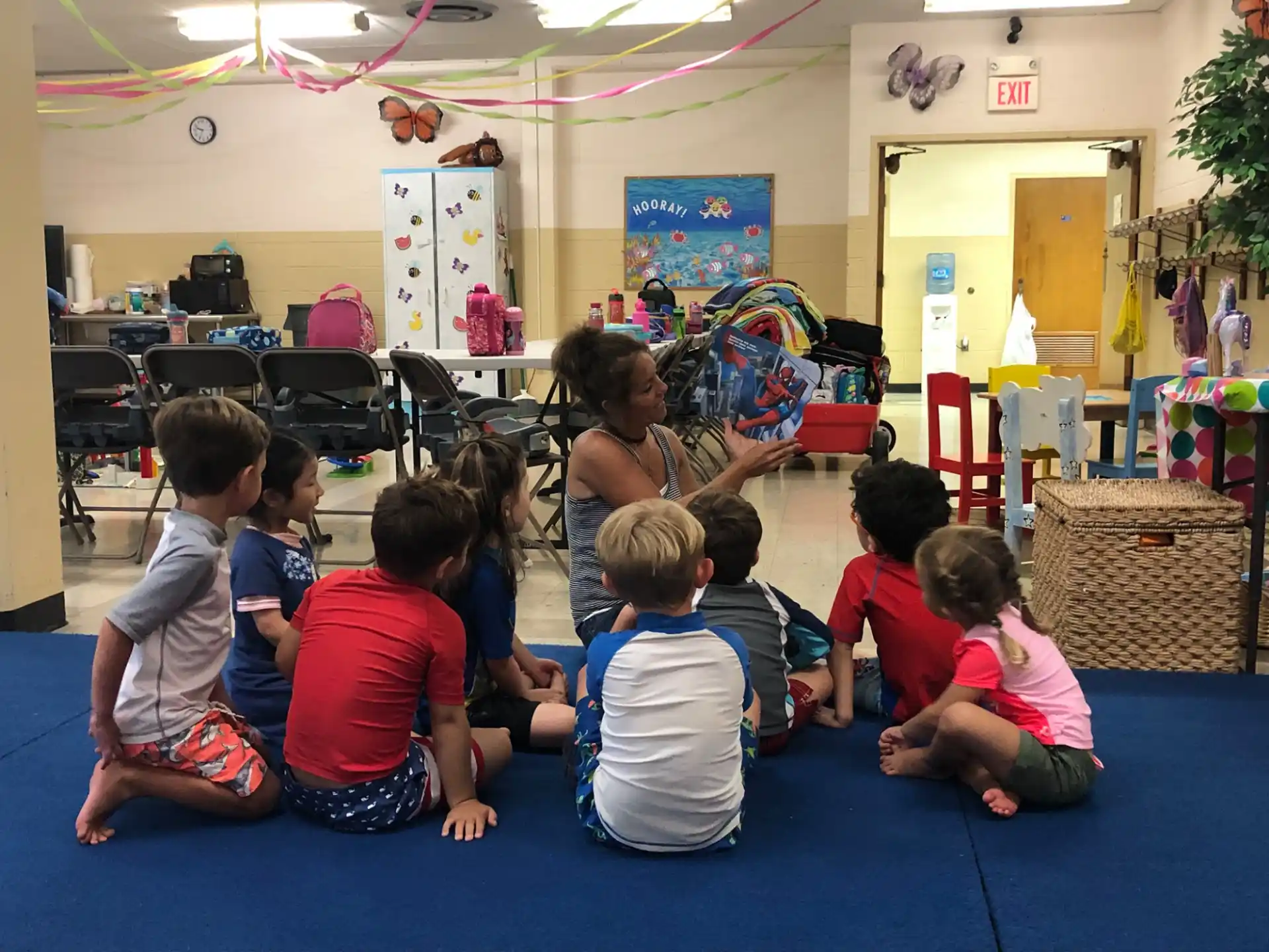 a group of children sitting on the floor