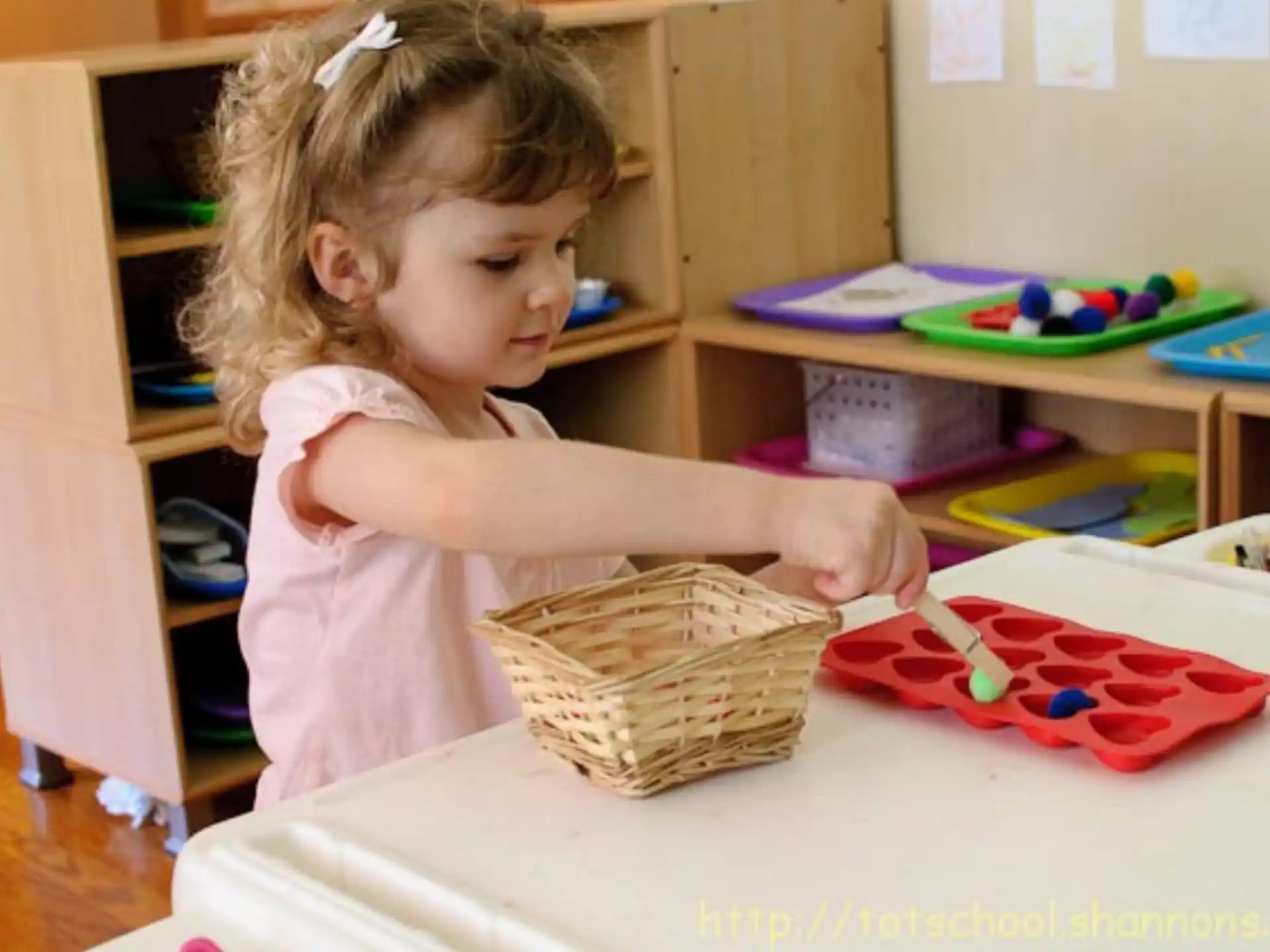 a little girl cutting a cake