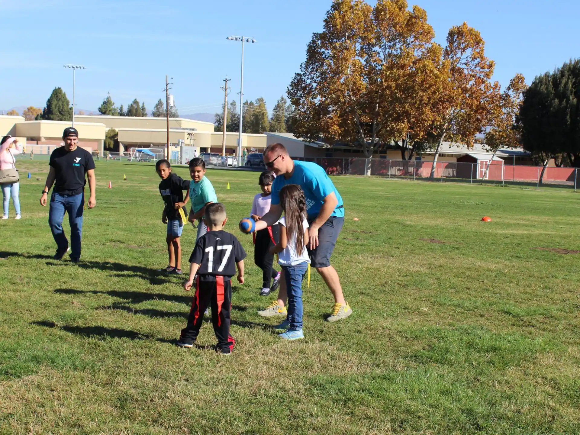 a group of people playing football