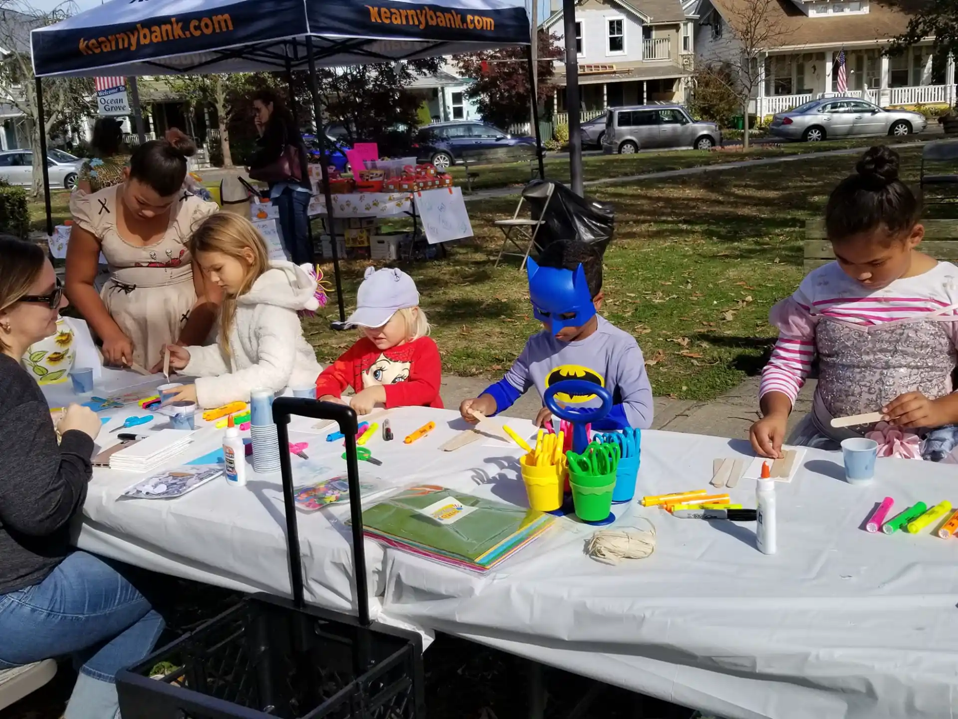 a group of people sitting at a table outside
