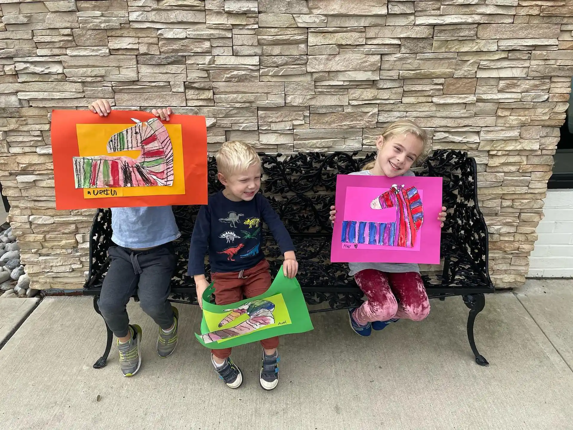 a couple of children holding signs