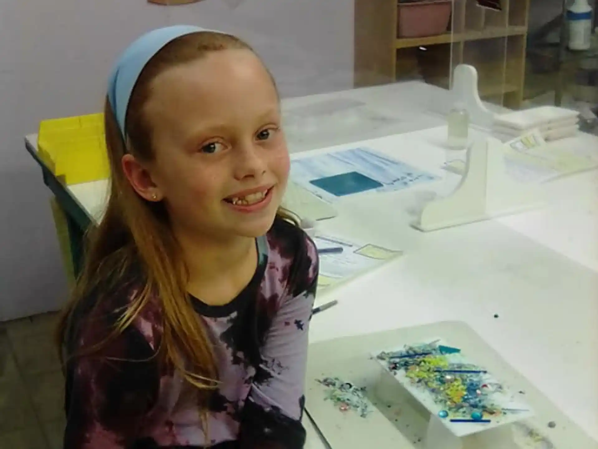 a young girl smiling