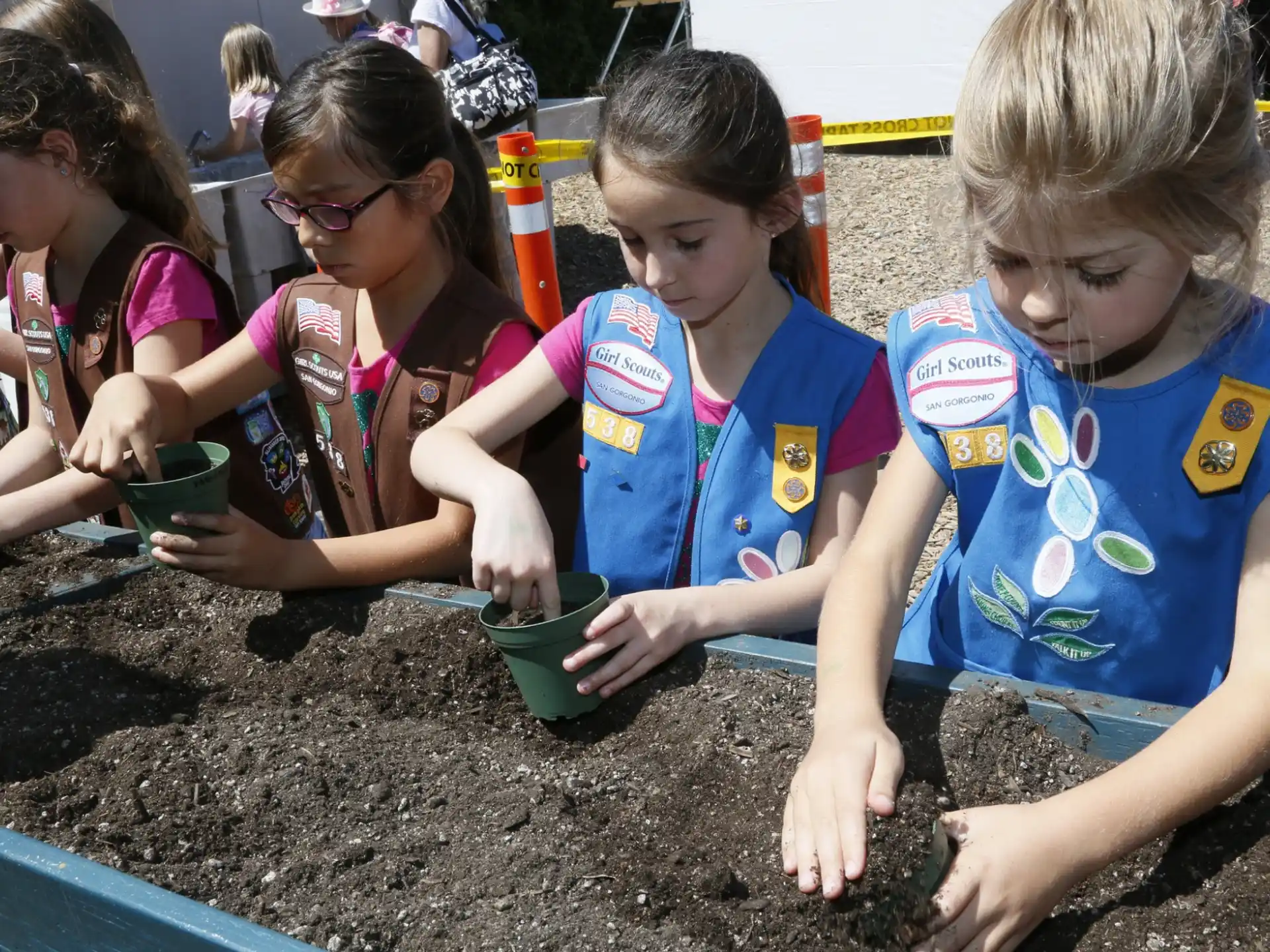 a group of children playing in the mud
