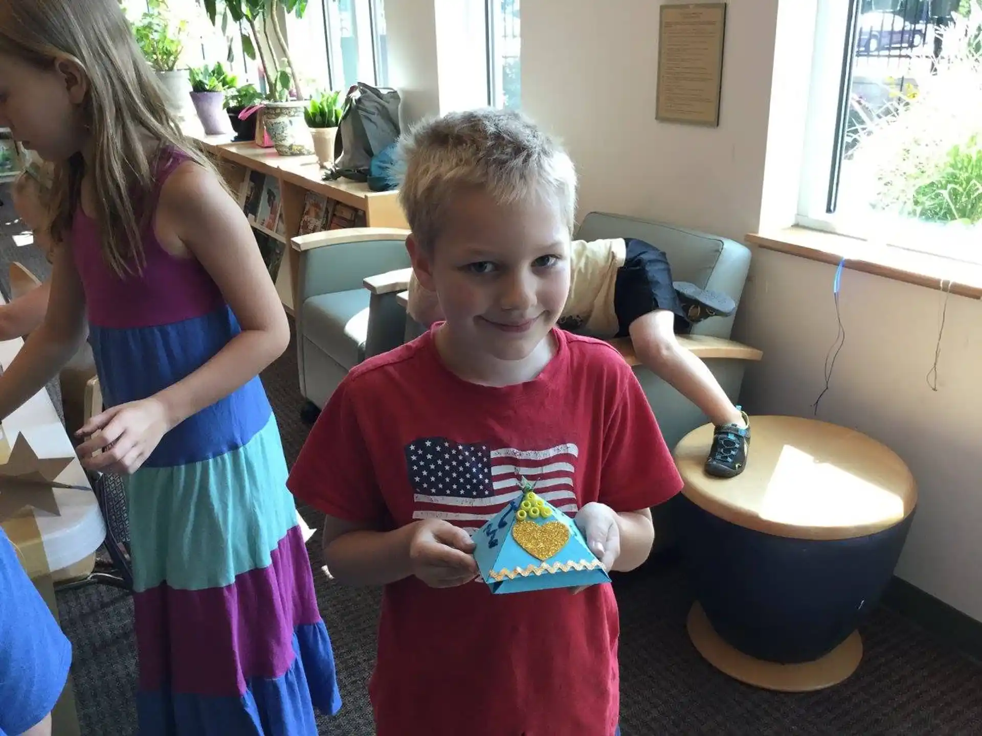 a child holding a cake