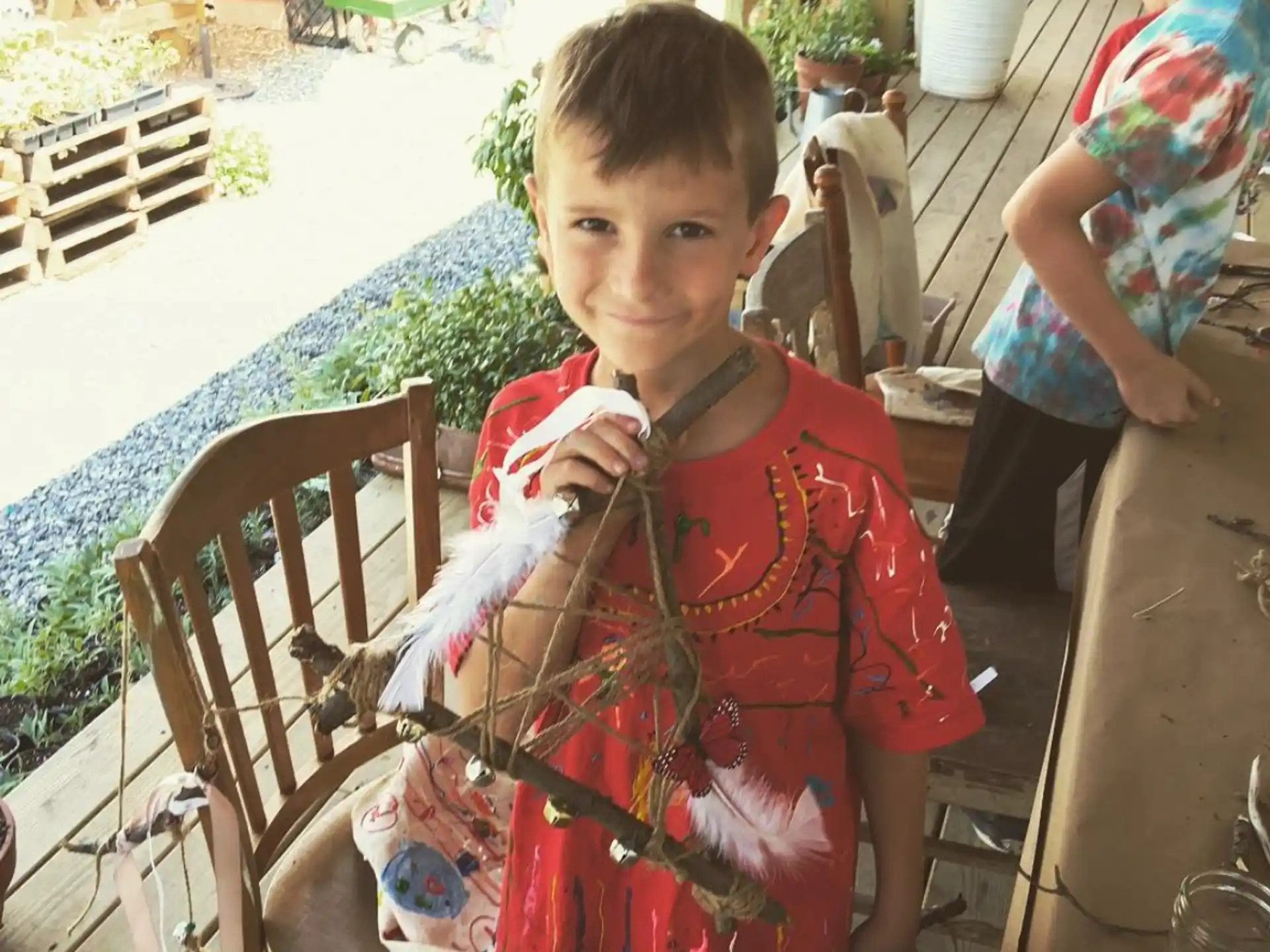 a boy holding a toy sword