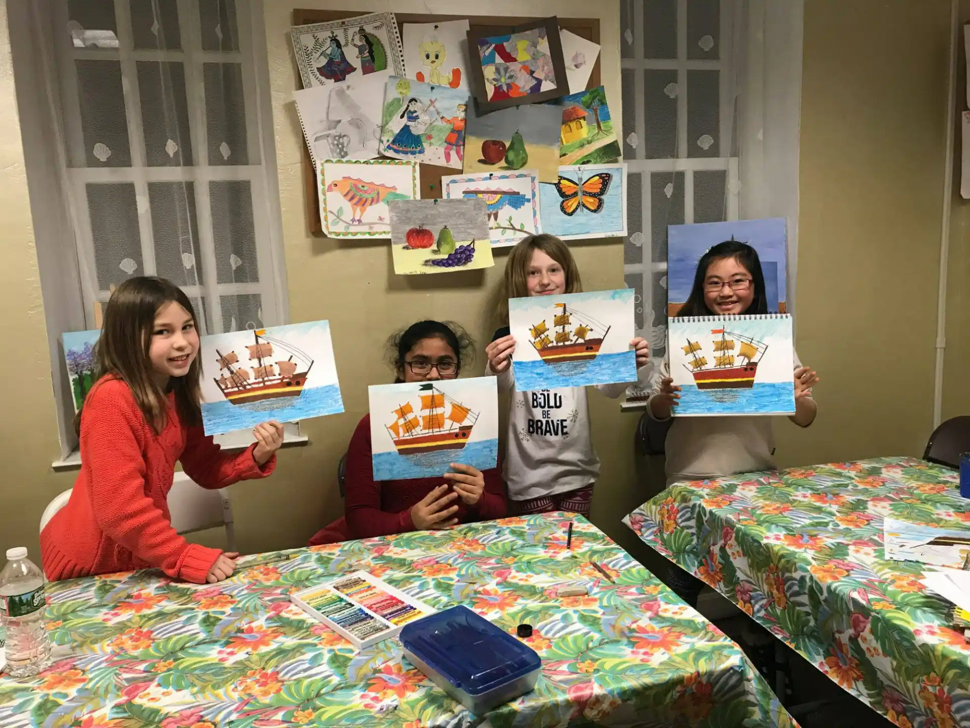a group of children holding up books