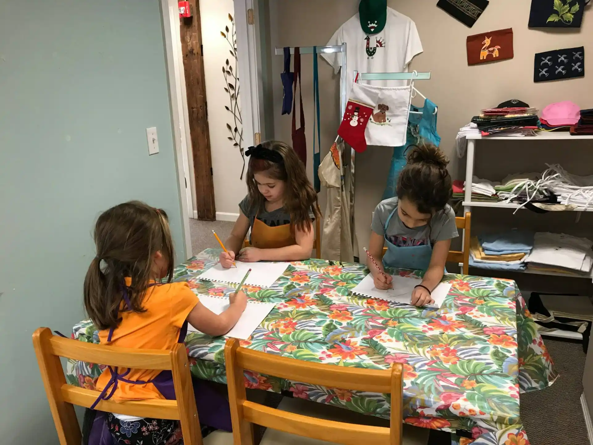 a group of children sitting at a table