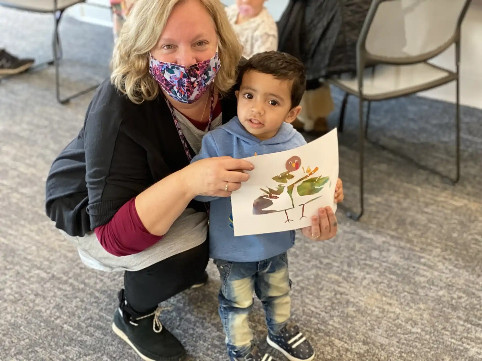 a person holding a child