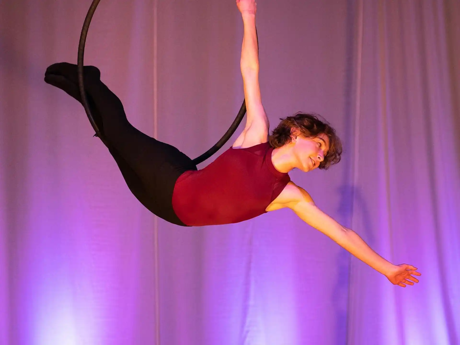 a person doing a handstand on a stage