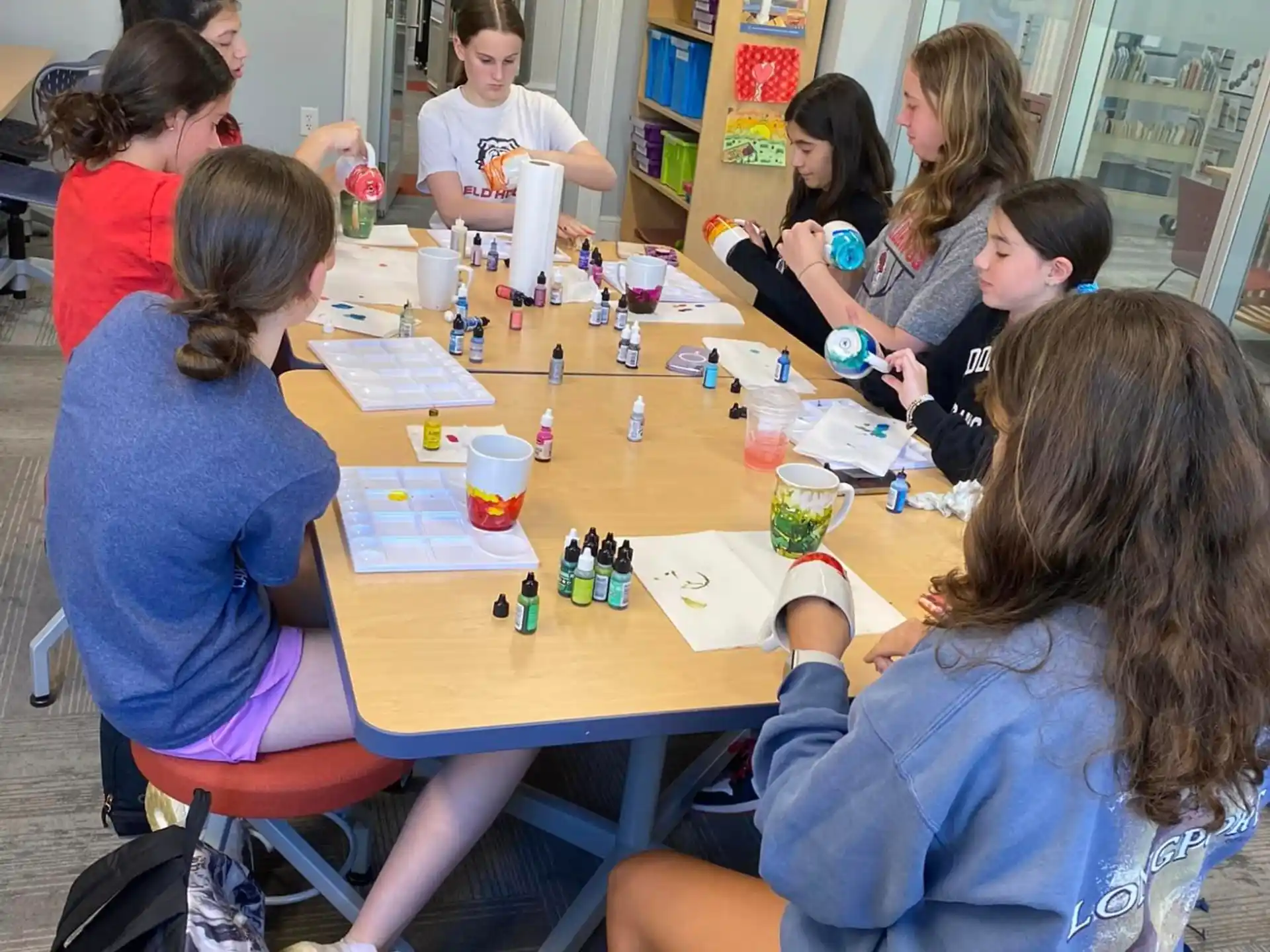 a group of people sitting around a table