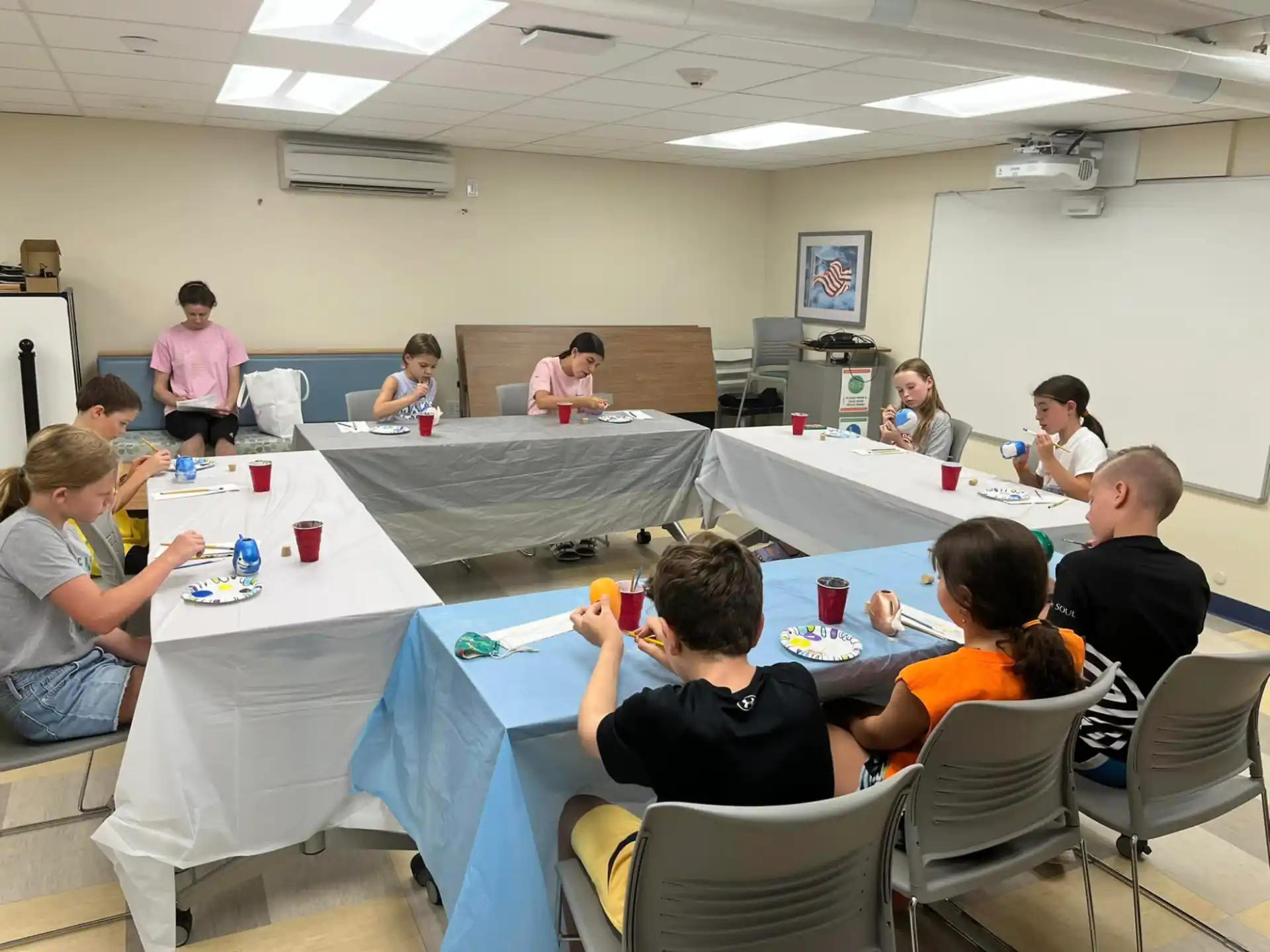 a group of people sitting at tables