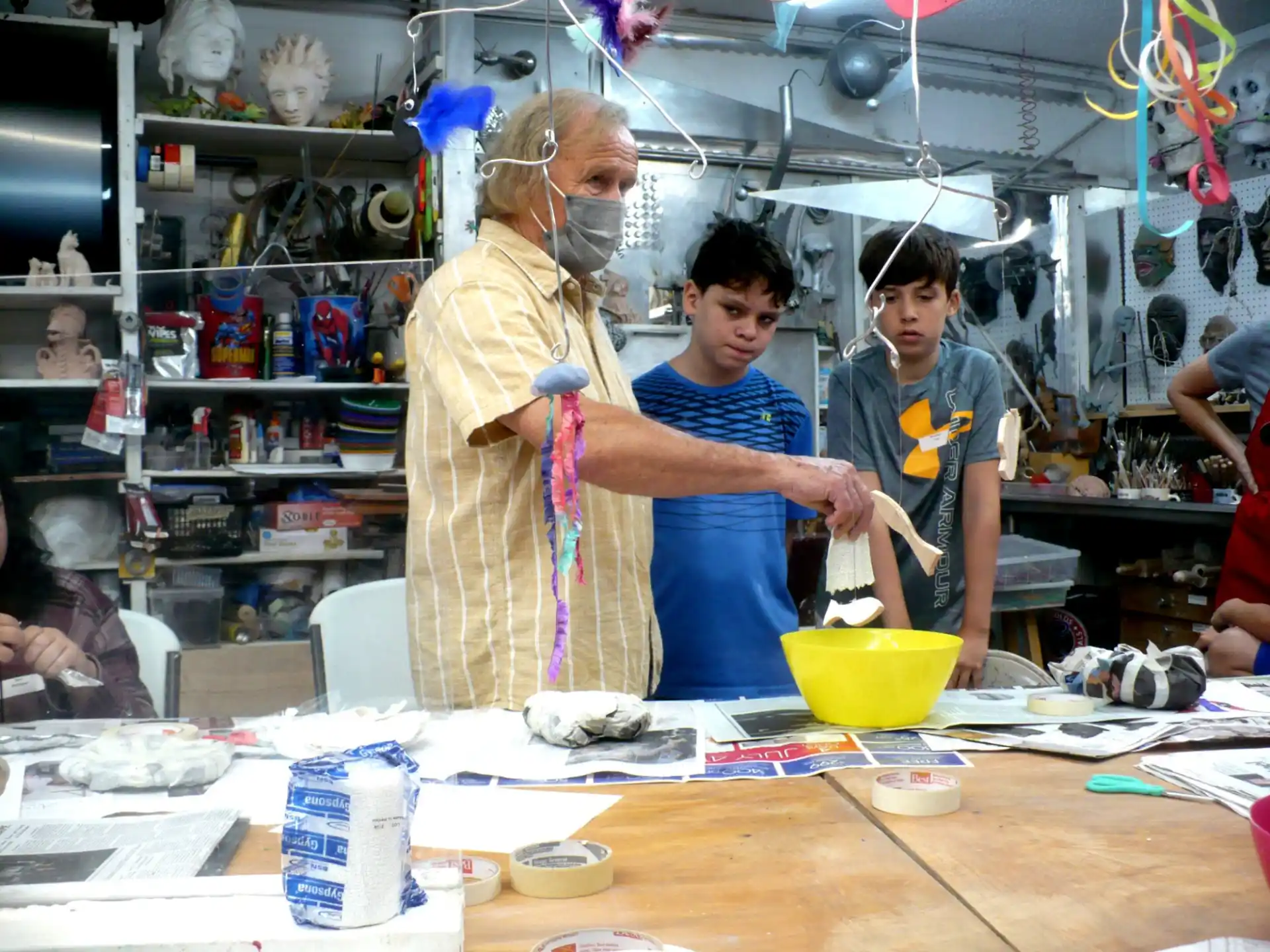 a group of people working in a shop