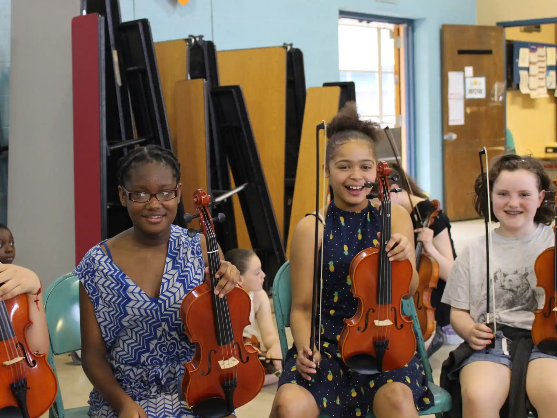 a group of kids playing instruments