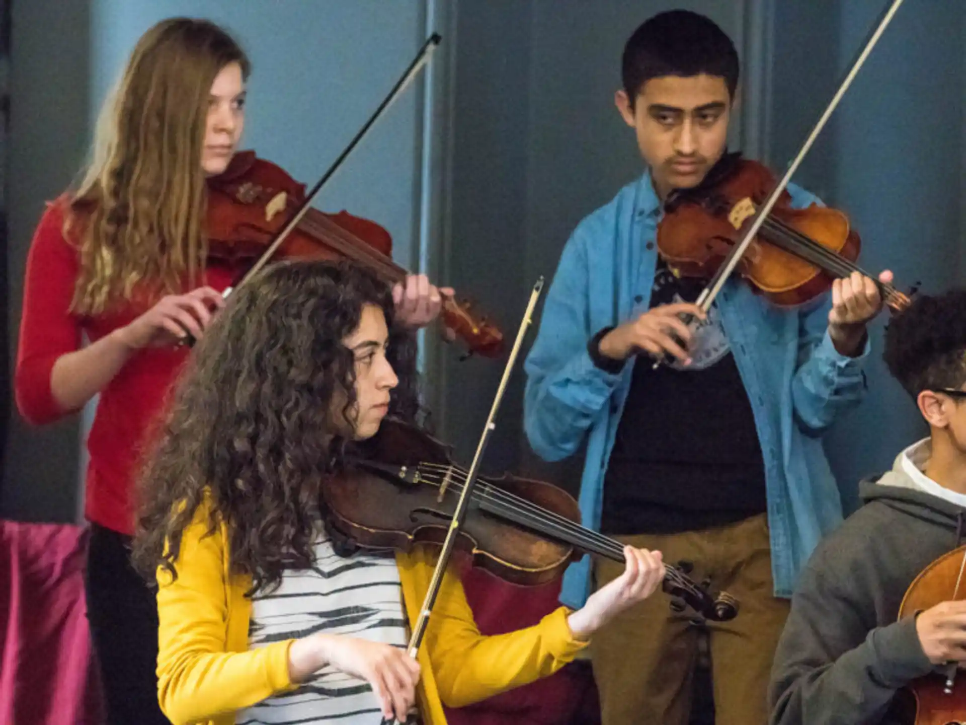 a group of people playing instruments