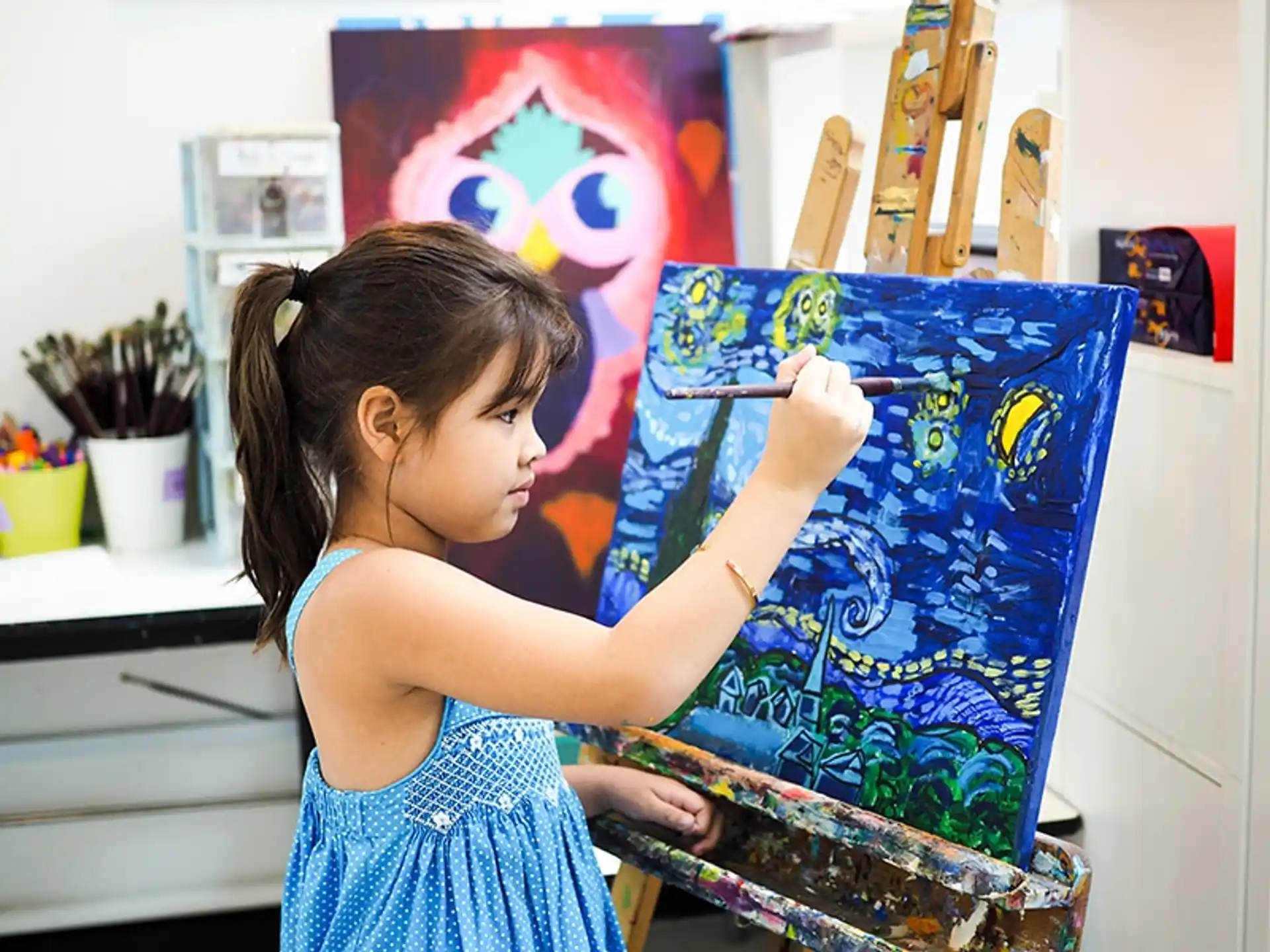 a young girl painting