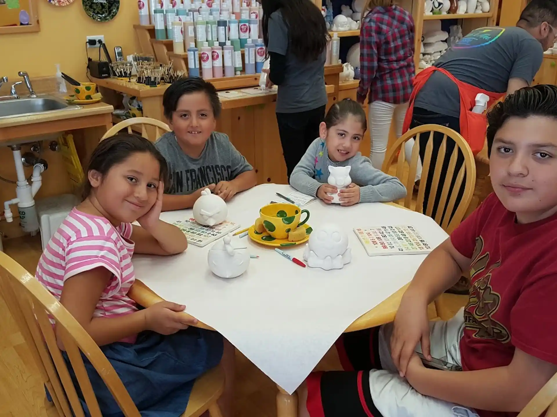 a group of people sitting around a table