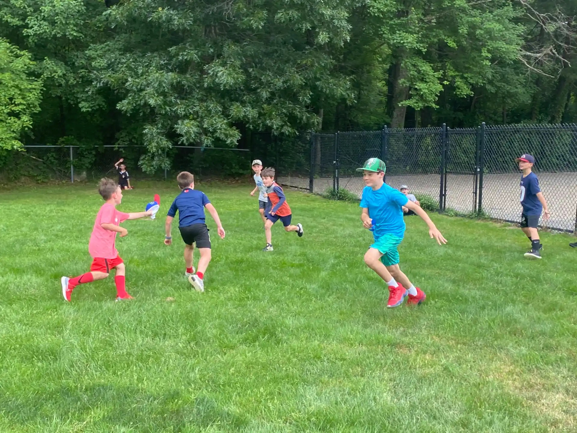 a group of kids playing football