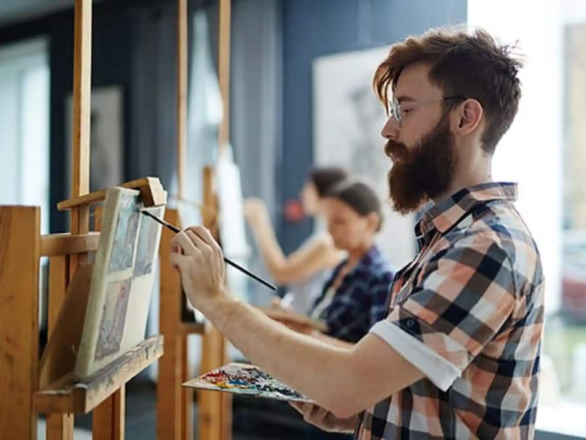 a man painting a picture