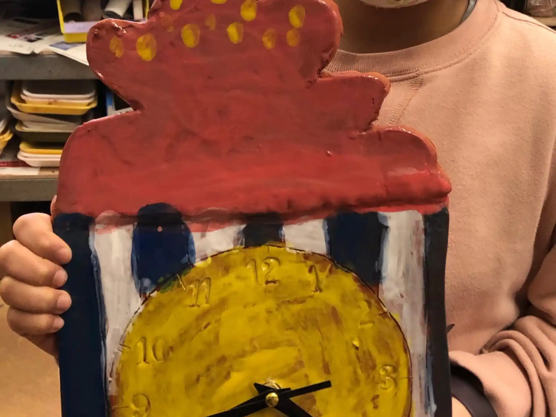 a girl holding a cake