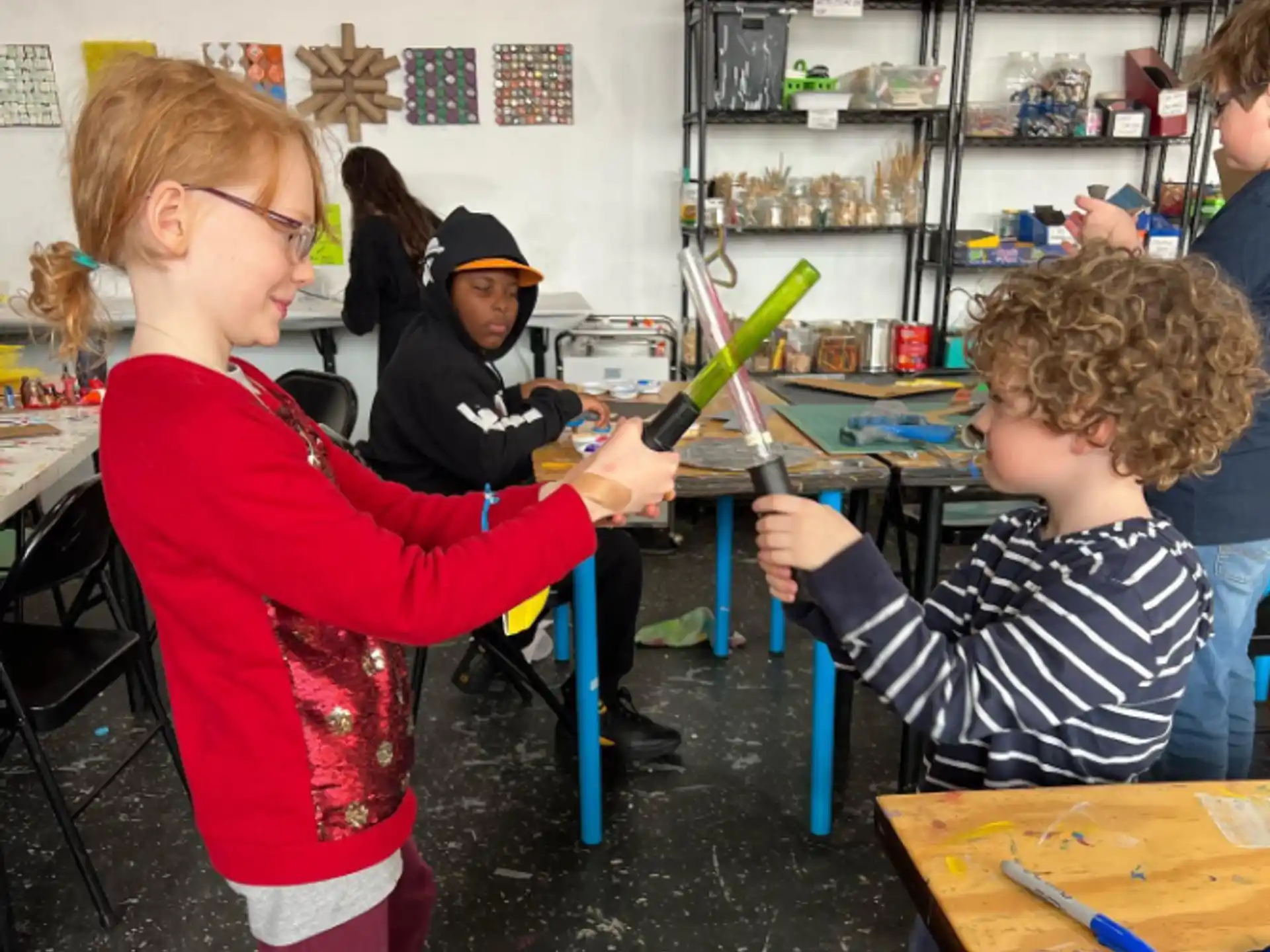 a person helping a child with a toy