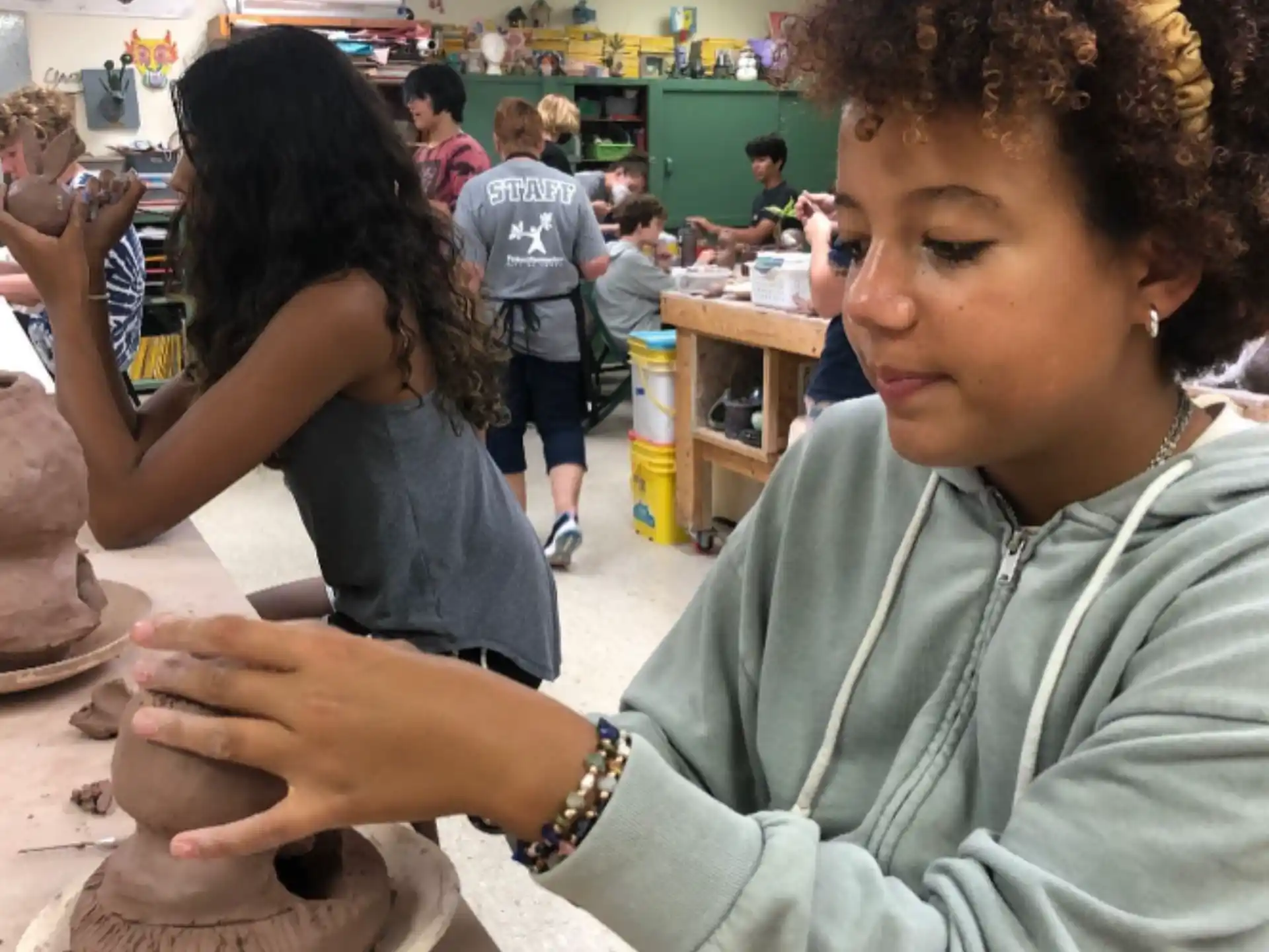 a person cutting a cake