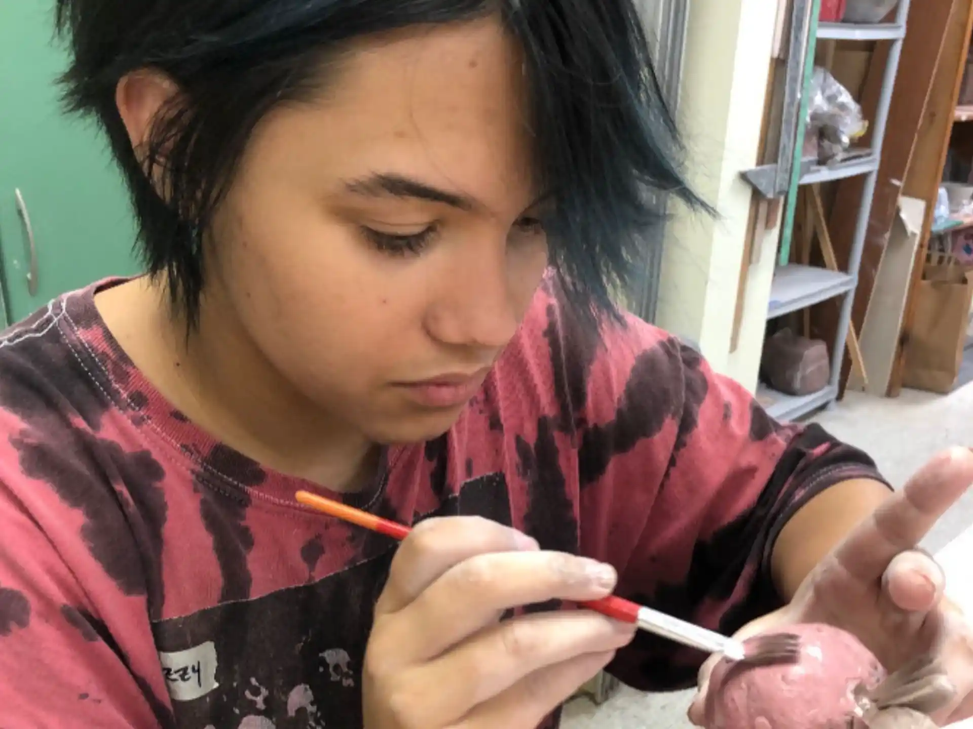 a woman painting a baby