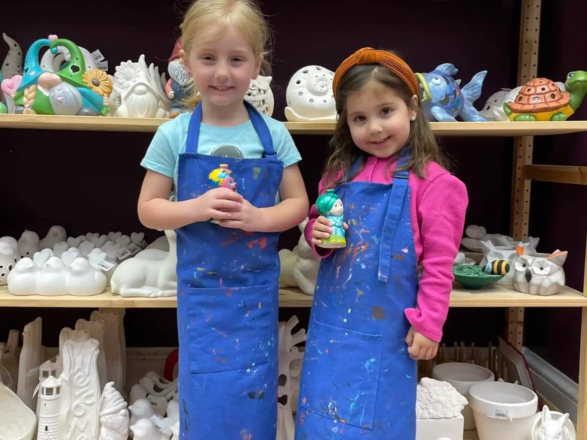 two girls in blue dresses