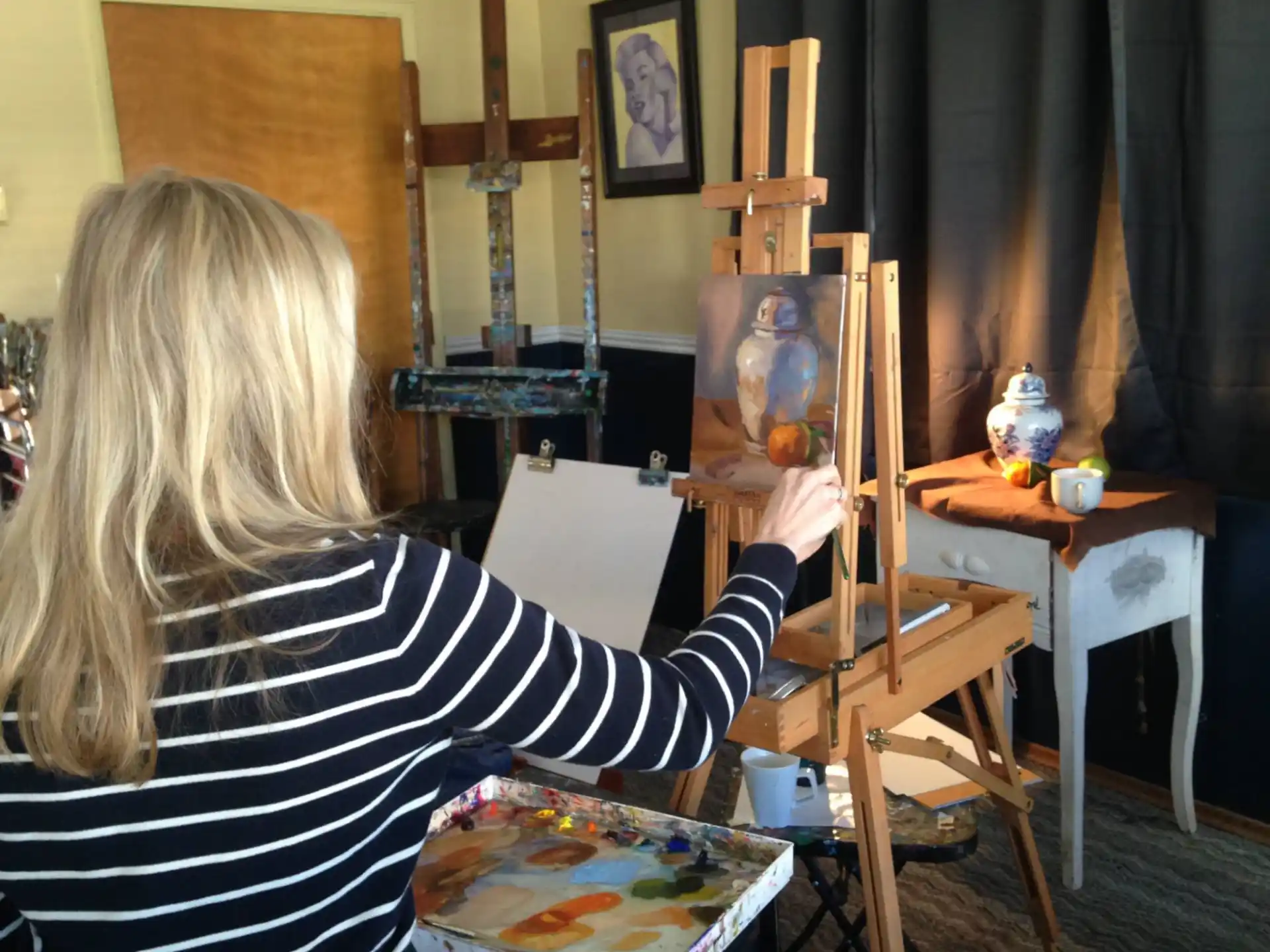a person painting in a room