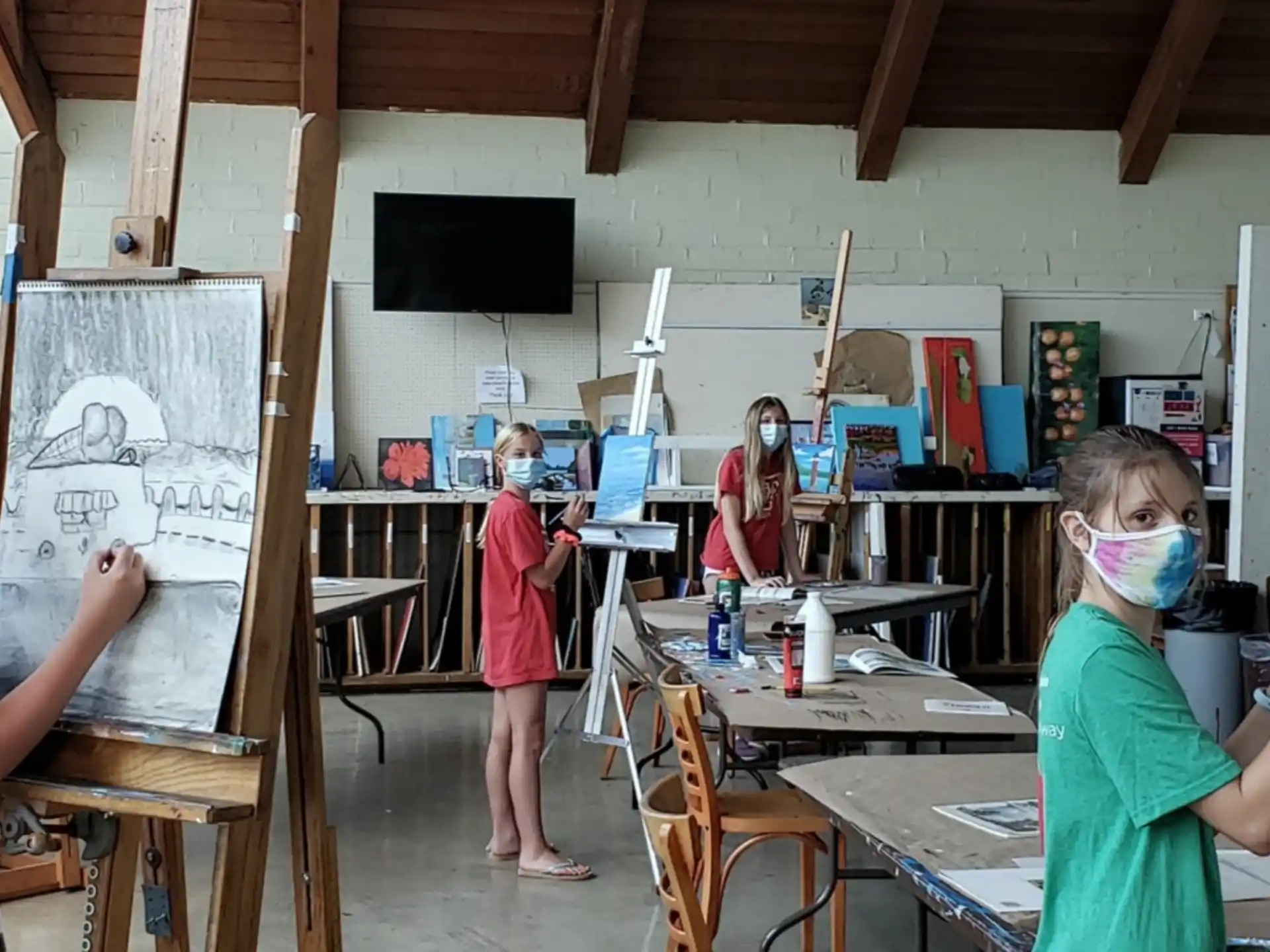 a group of people painting in a room