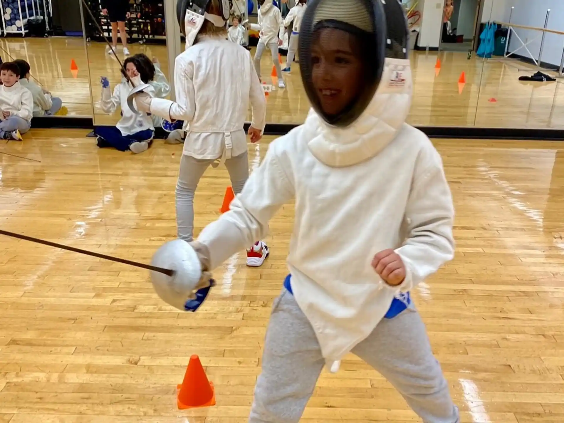 a group of kids in karate uniforms