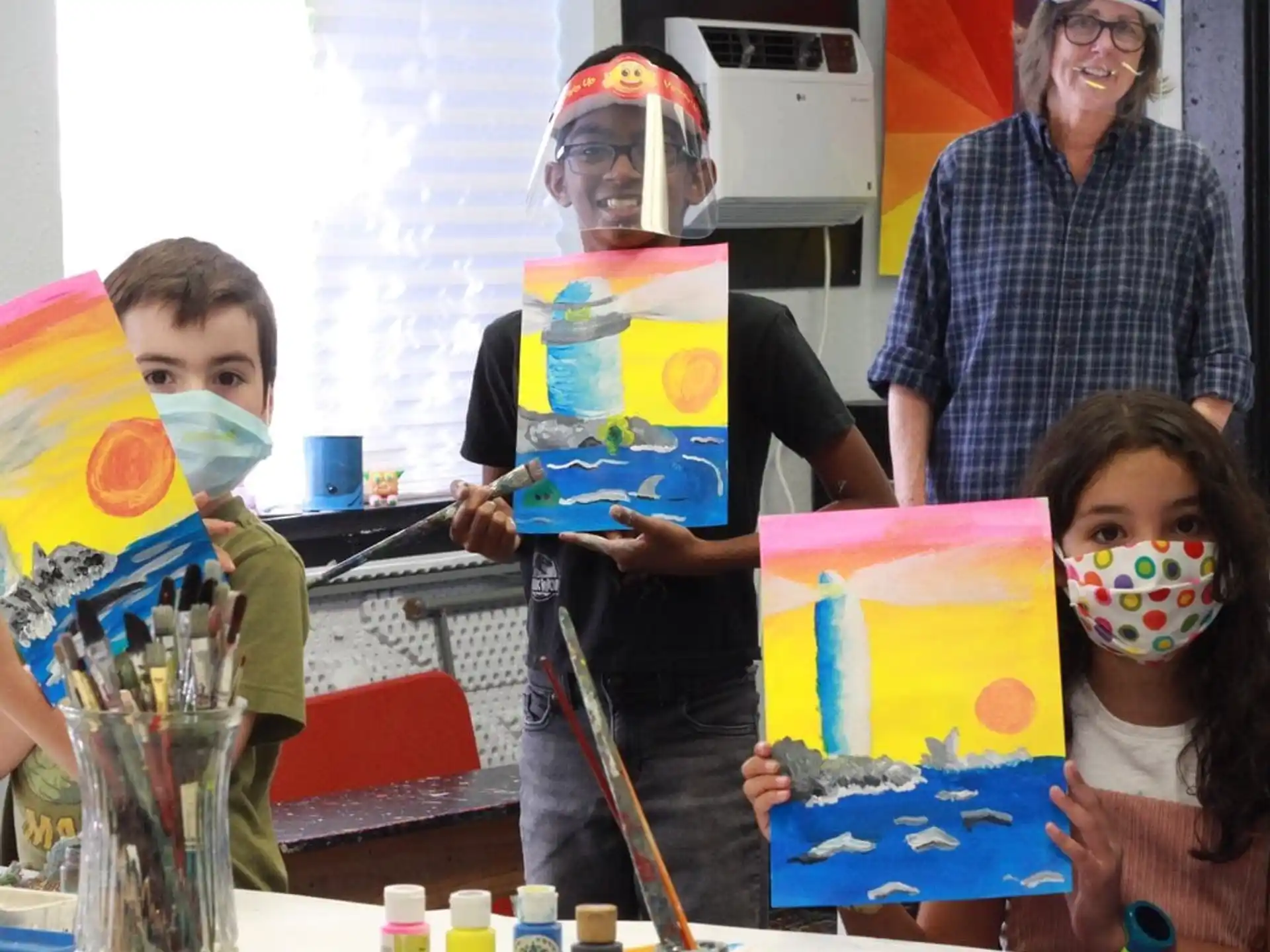 a group of people painting