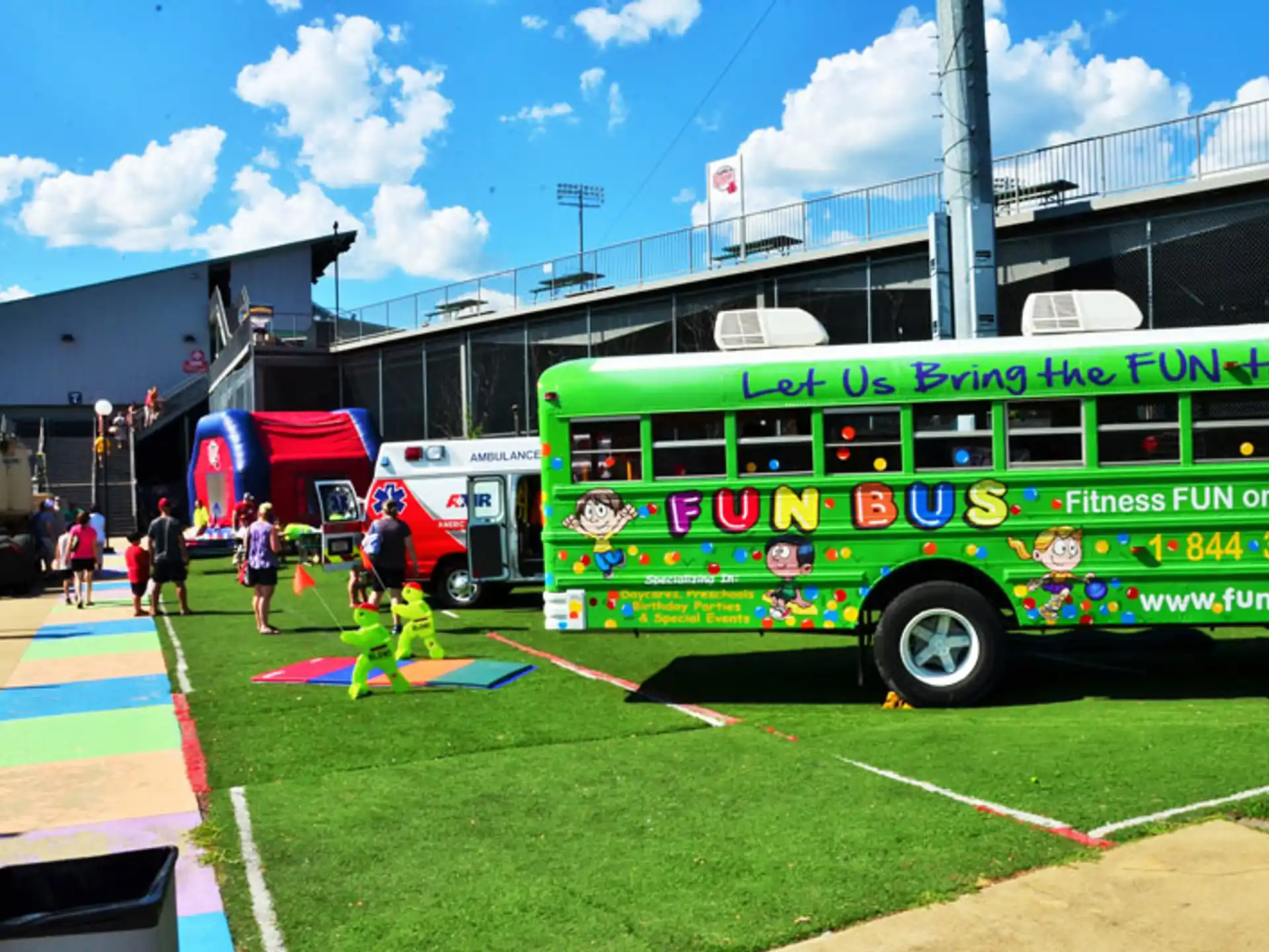 a green bus parked on grass
