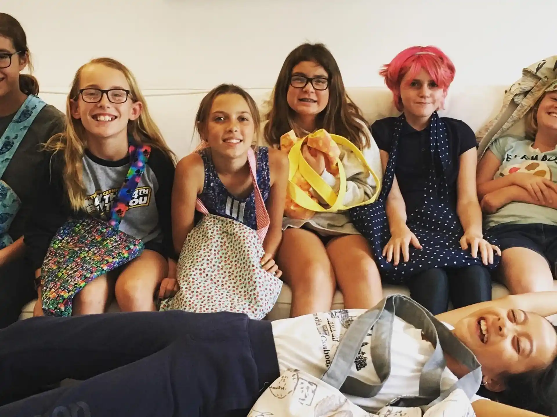 a group of women sitting on a couch