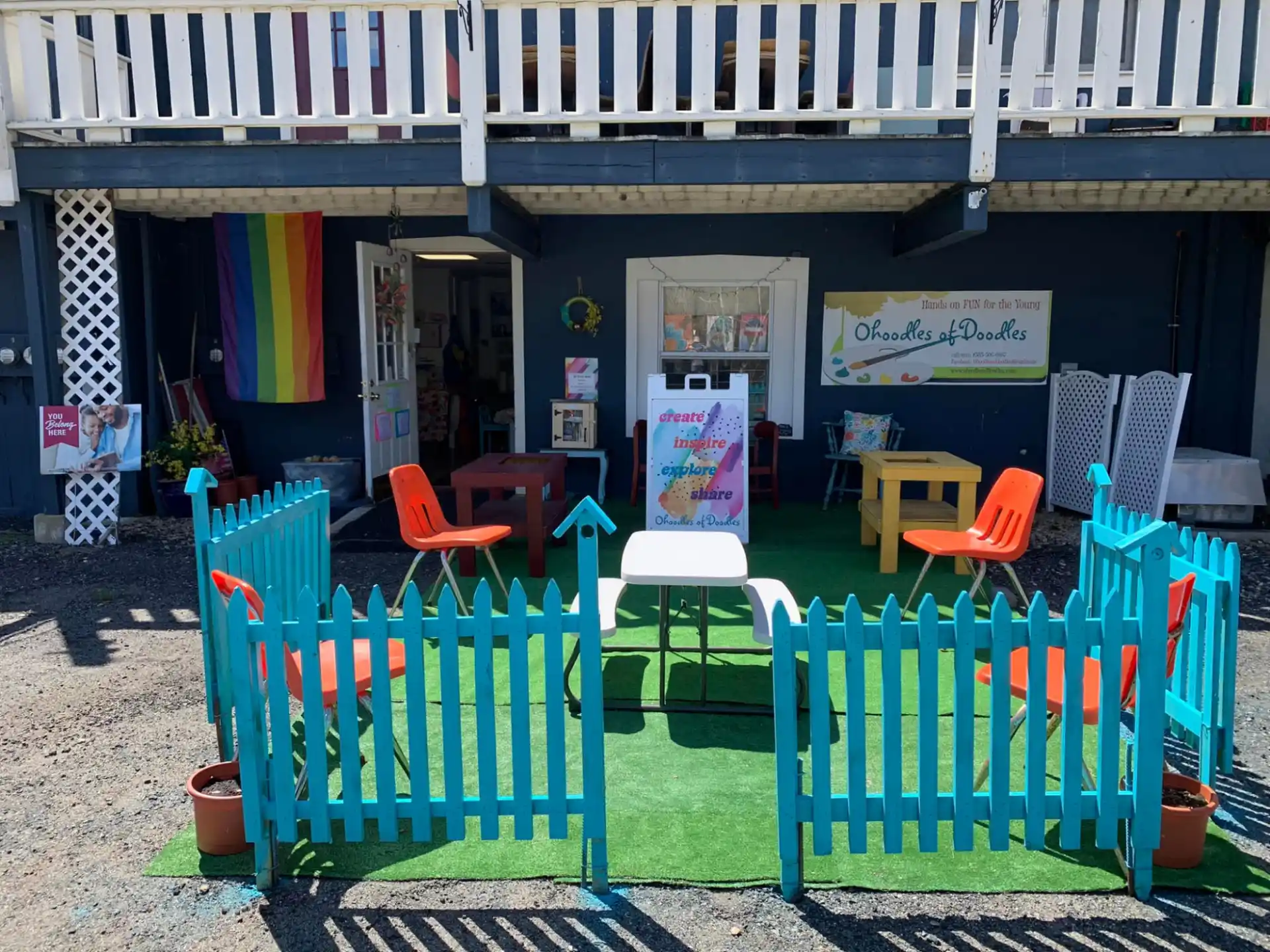 a group of colorful chairs outside a building