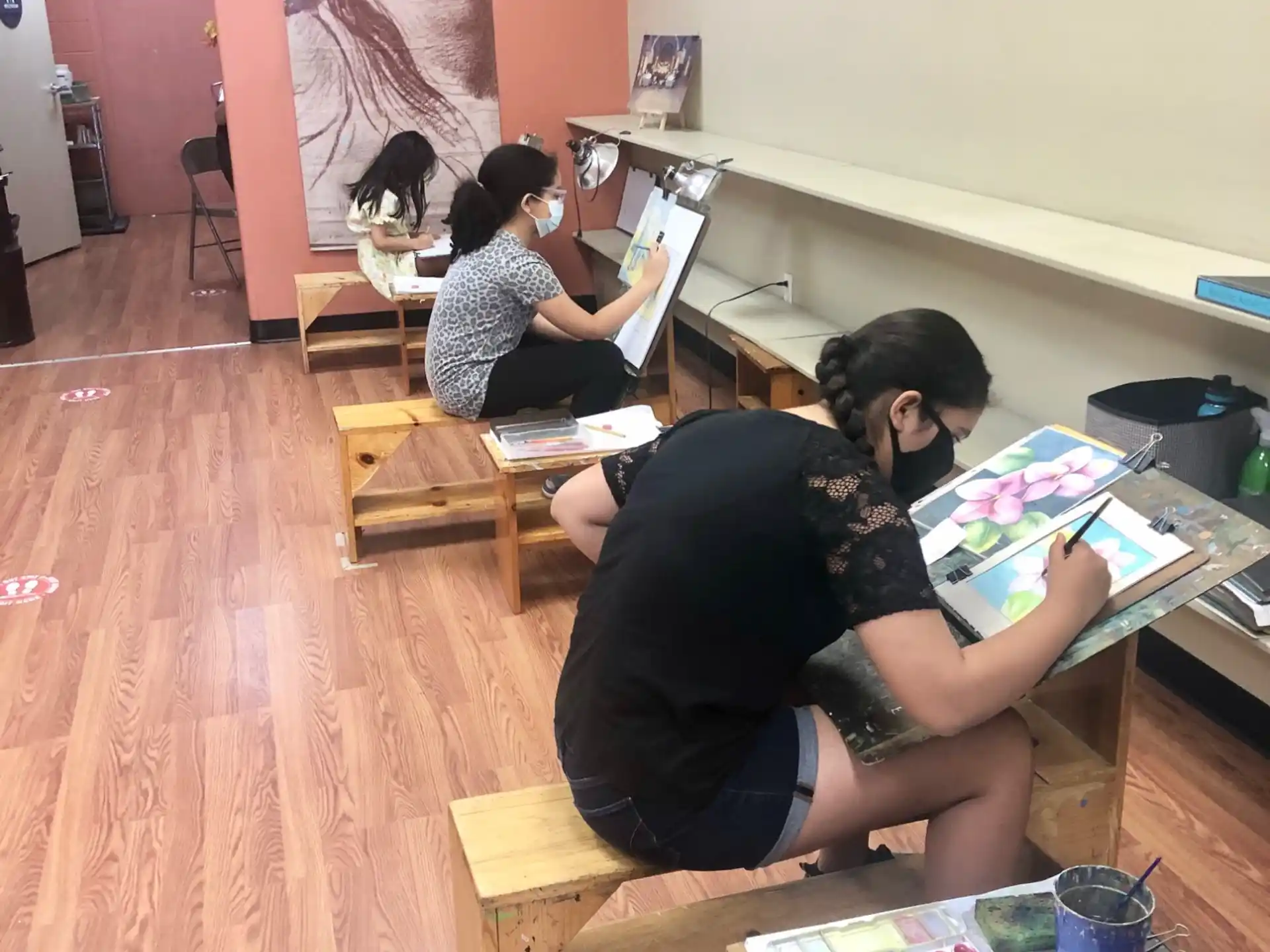 a man and woman sitting at a table with a book and a book