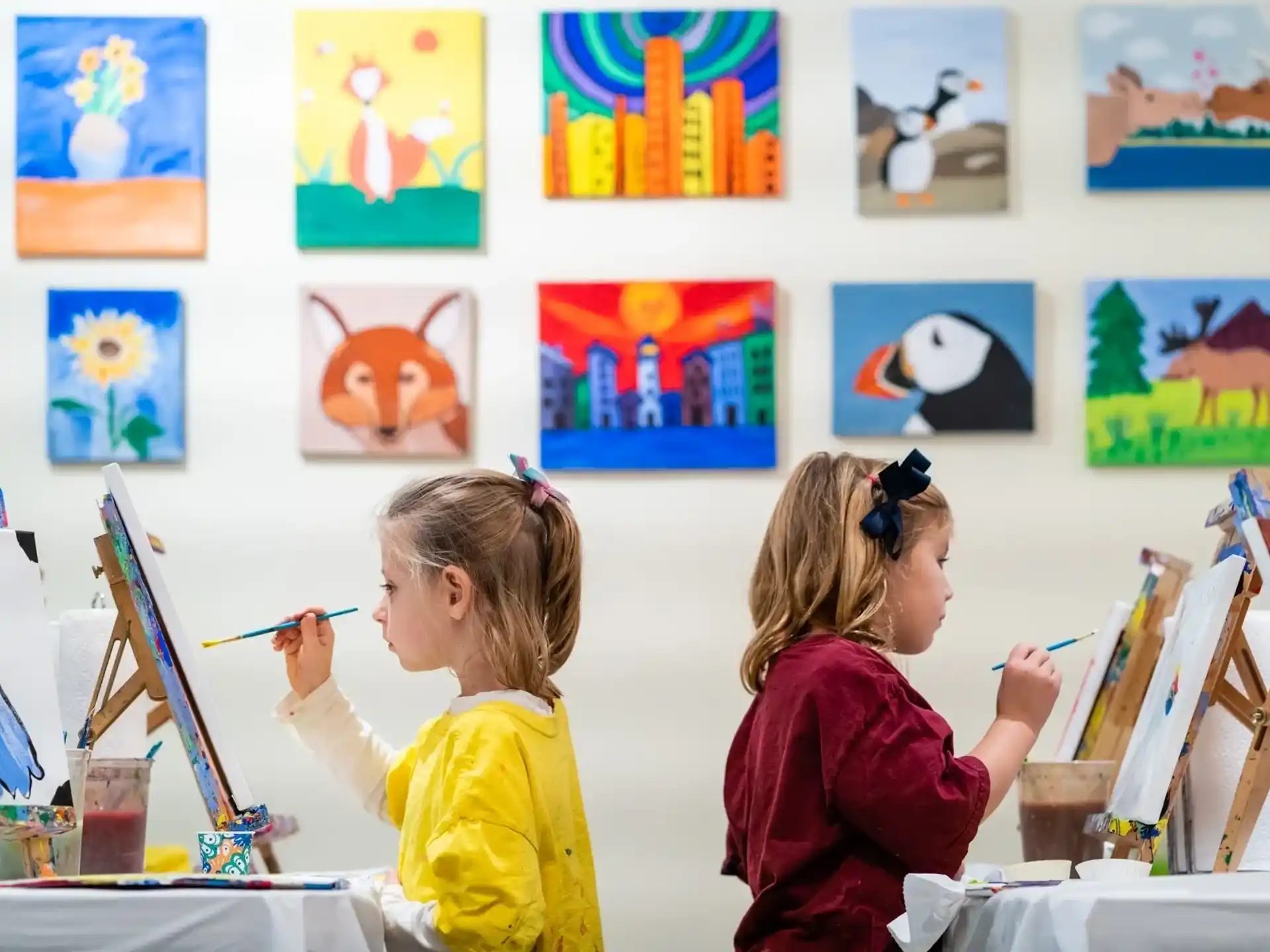 a few young girls painting