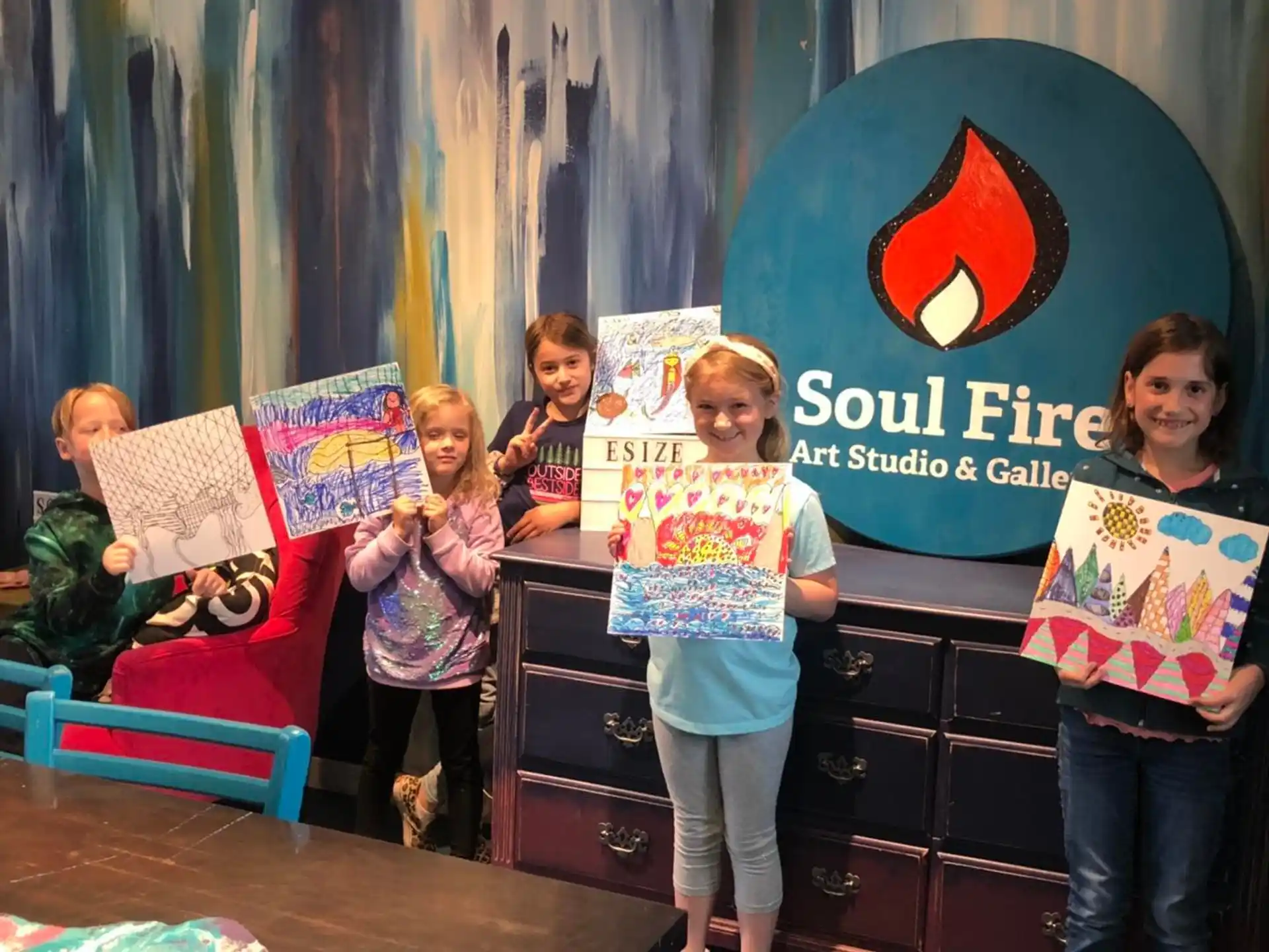 a group of children holding books