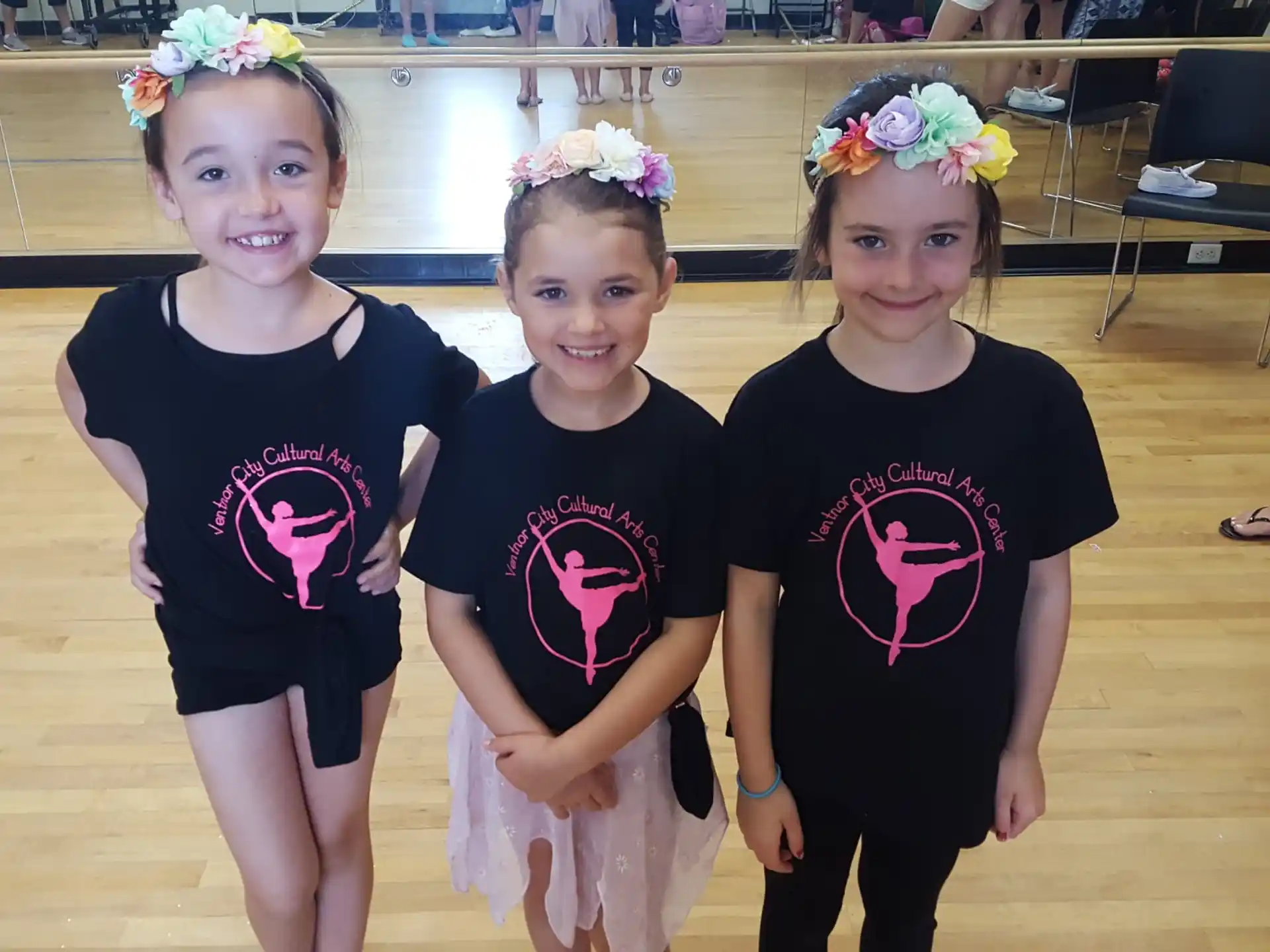 a group of girls wearing matching t-shirts