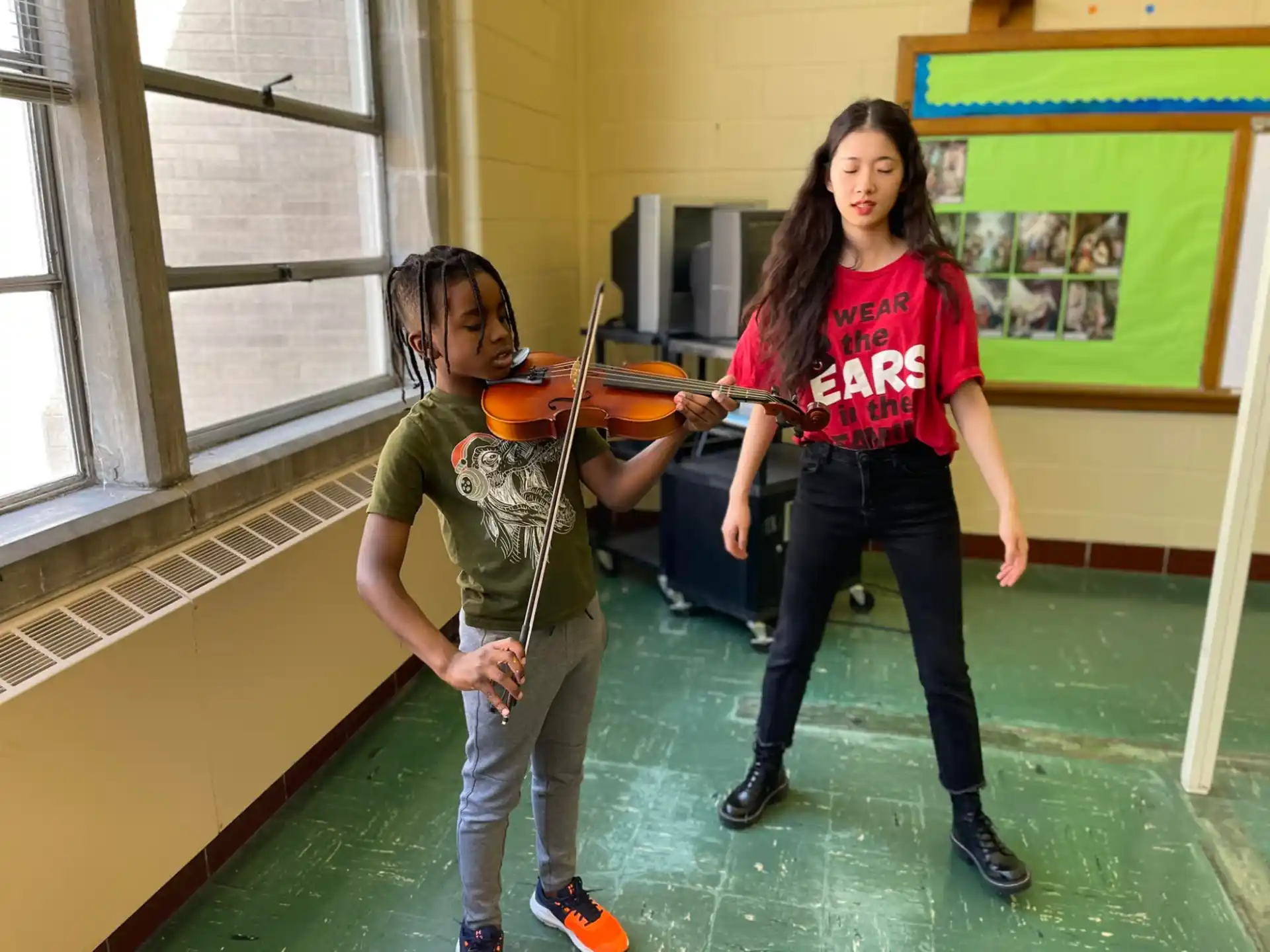 a couple of girls in a classroom