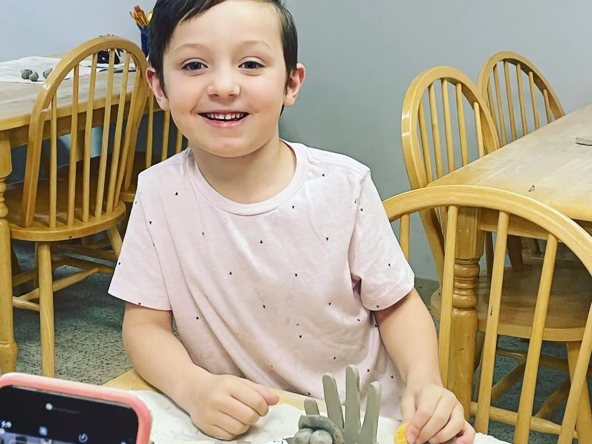 a boy sitting at a table