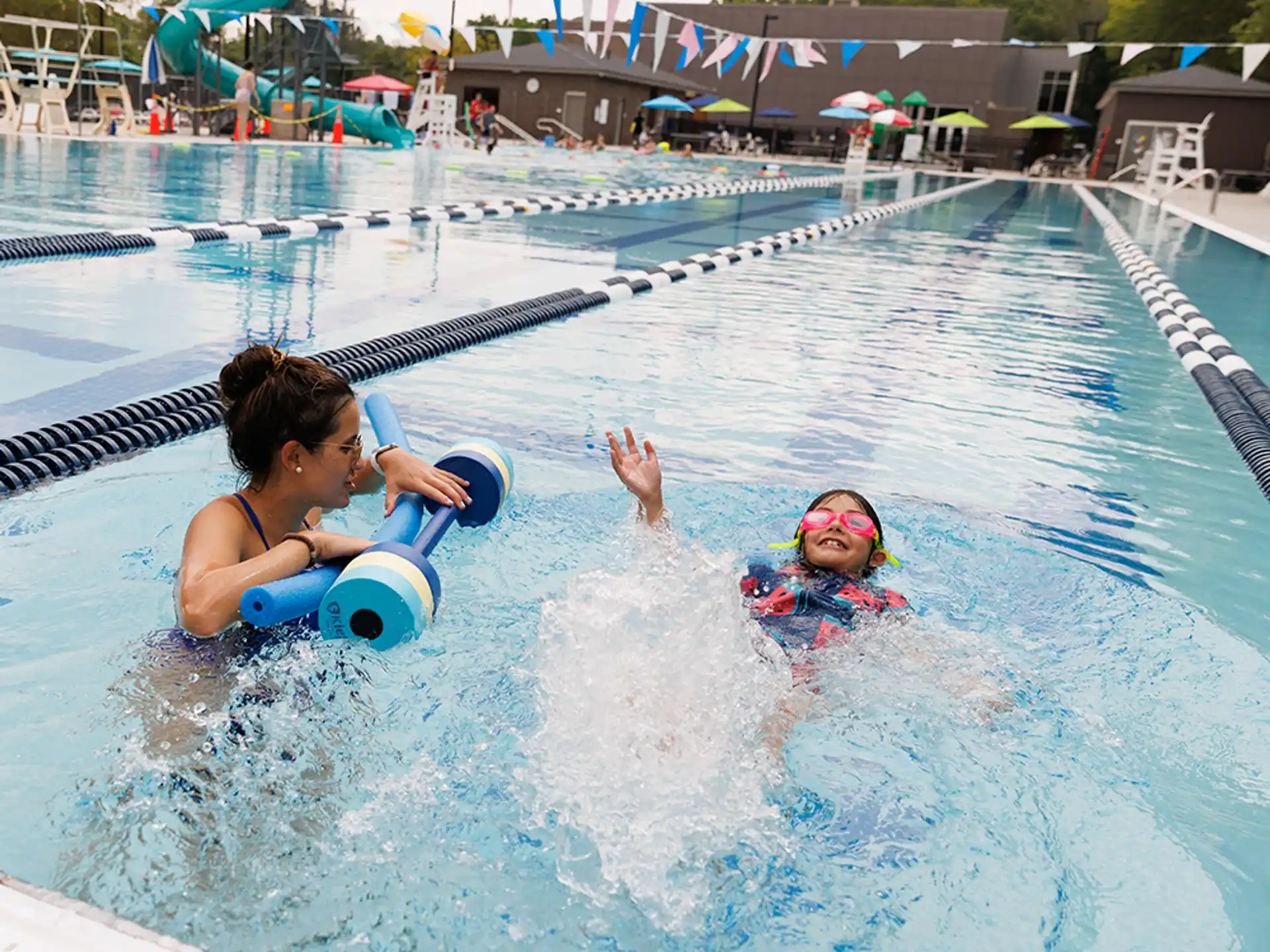 a couple of people in a pool